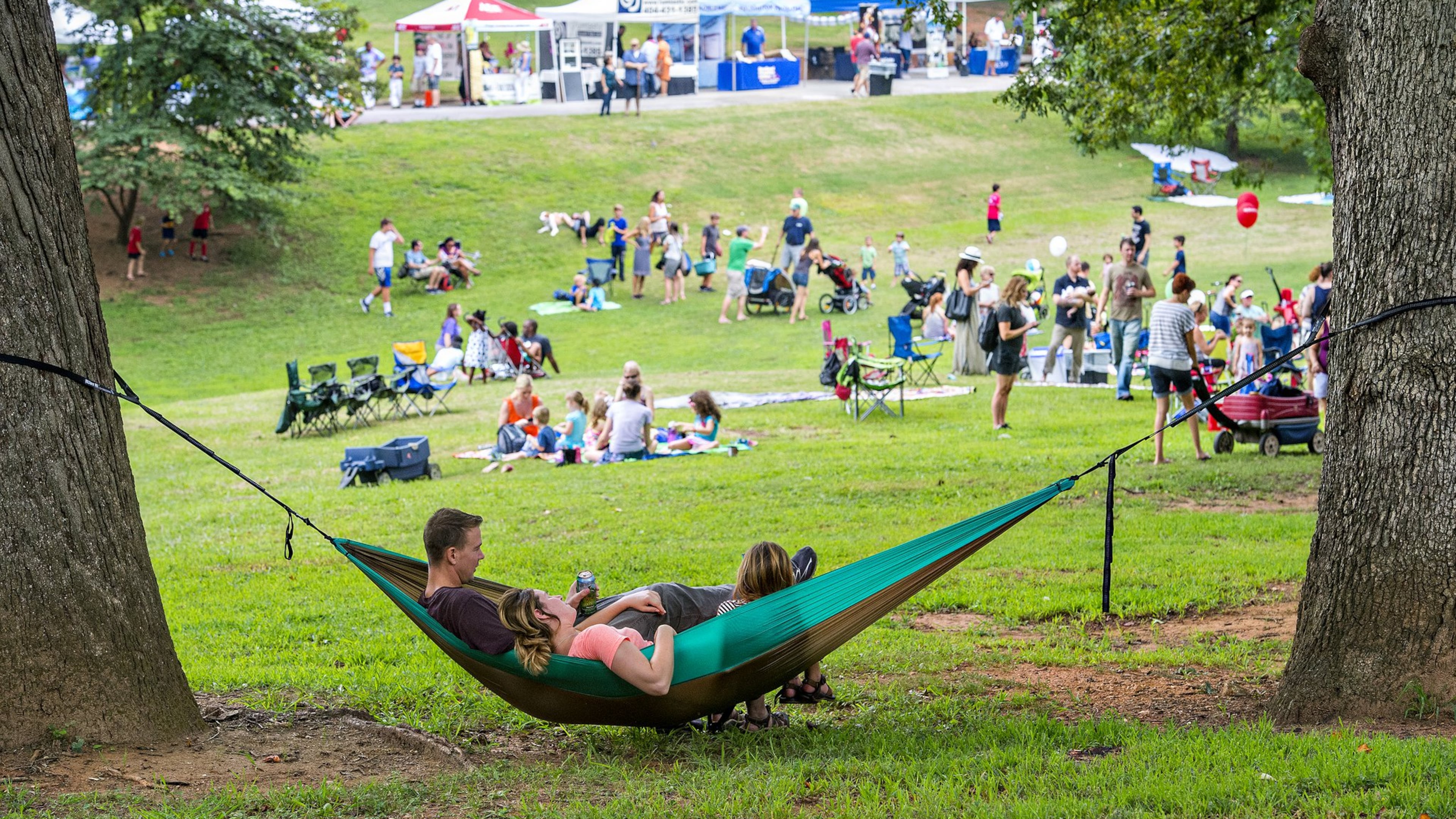 The giant trees in Grant Park offer relief from the heat during the annual Summer Shade Festival which has live music, food and children’s activities.