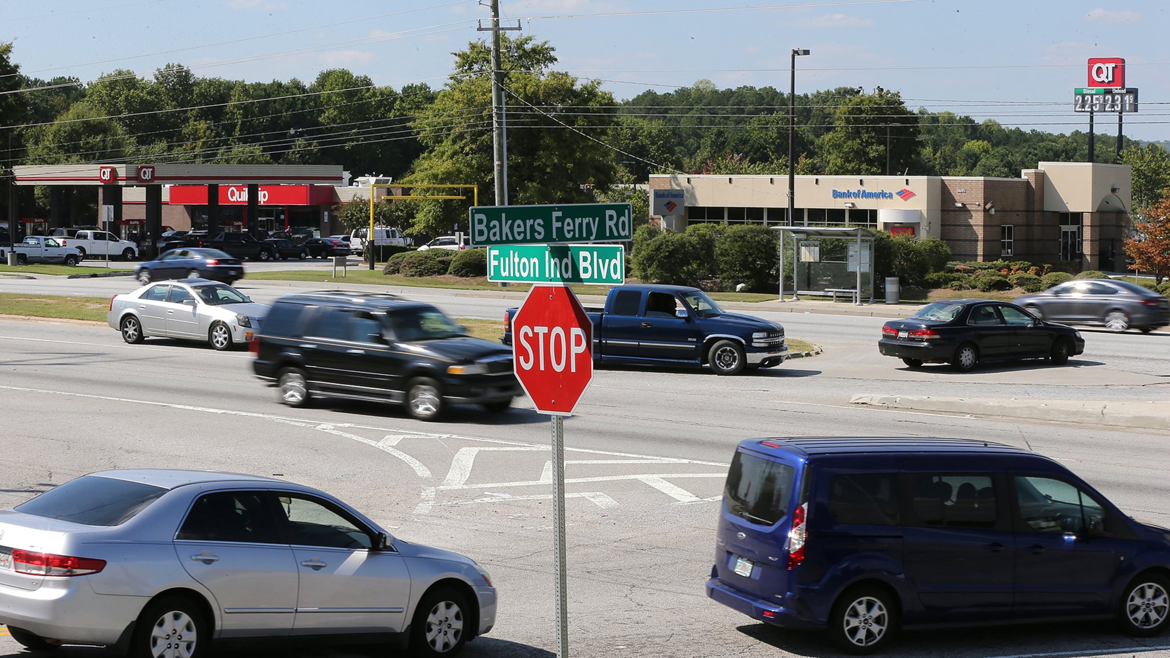 A vibrant flow of traffic passes by a gas station and a bank at the intersection of Fulton Industrial Boulevard at Bakers Ferry Road. Atlanta and South Fulton are sparring about annexing the last unincorporated area in the county, on Fulton Industrial Boulevard. Curtis Compton /ccompton@ajc.com AJC FILE PHOTO