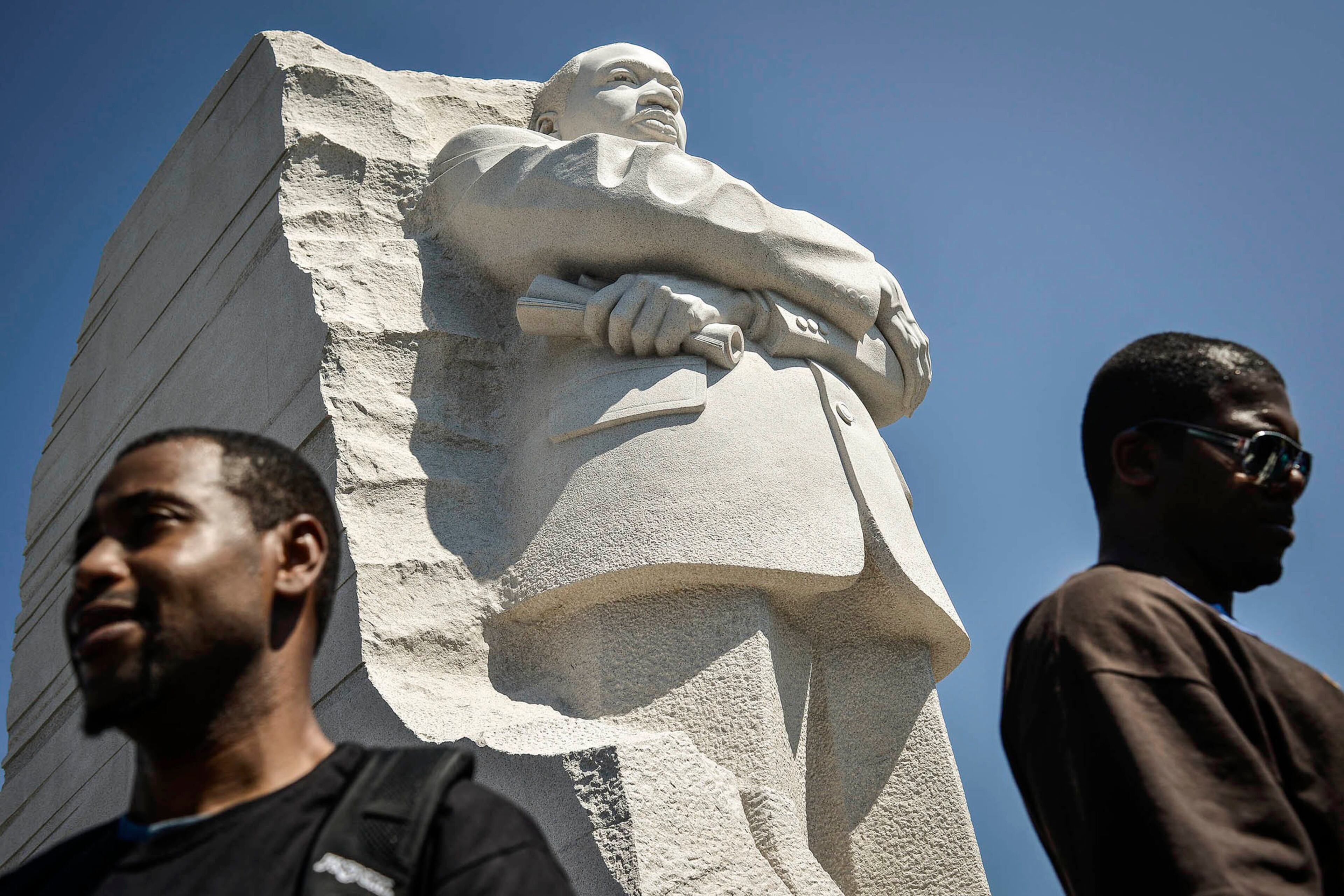 Participants gather at the Martin Luther King Jr. Memorial during the Realize the Dream Rally for the 50th anniversary of the March on Washington August 24, 2013. Thousands of marchers were expected in Washington, D.C. on Saturday to commemorate the 50th anniversary of the Rev. Martin Luther King Jr.'s "I have a dream" speech and to urge action on jobs, voting rights and gun violence. REUTERS/James Lawler Duggan