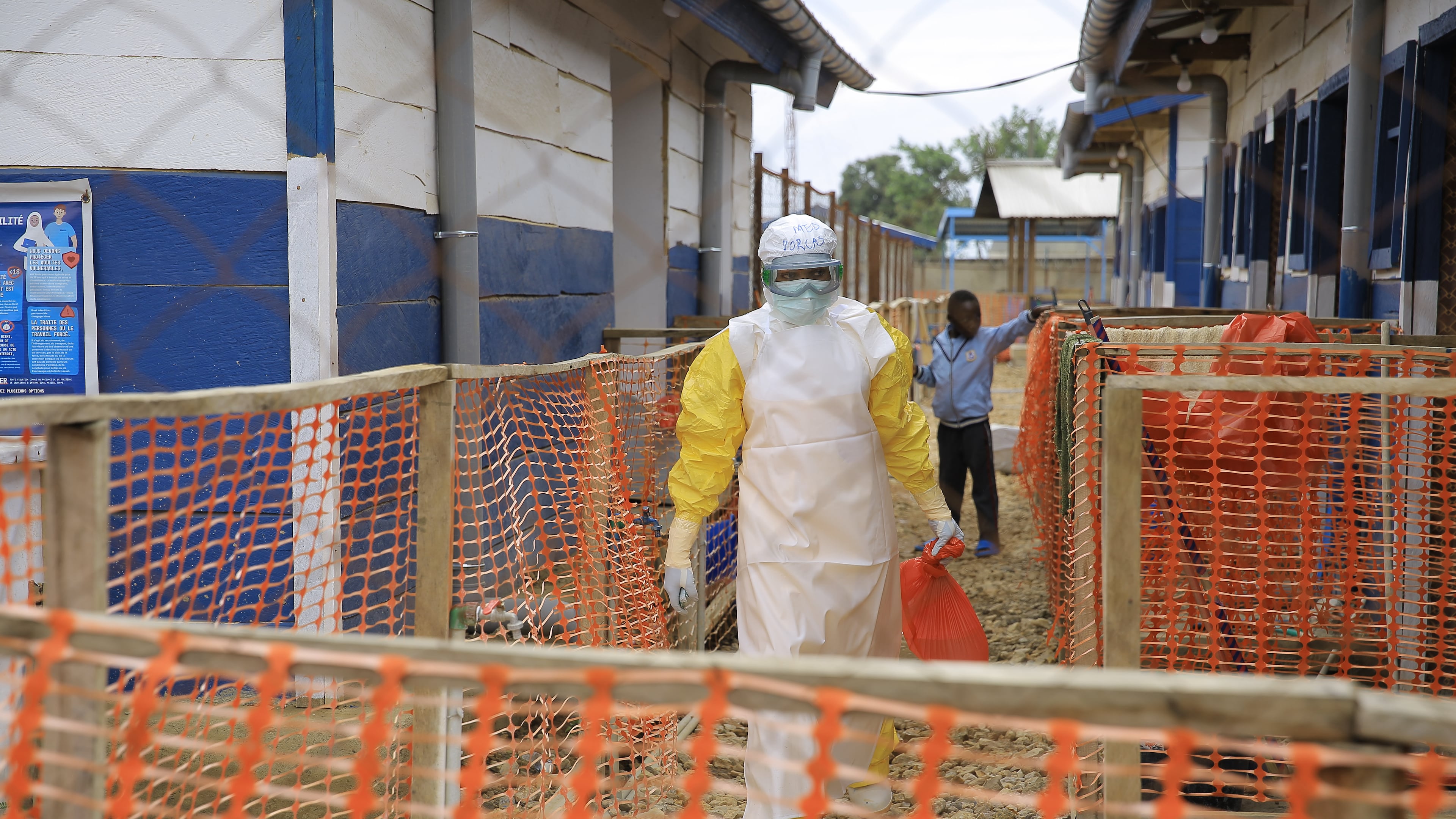 A healthcare worker walks inside a treatment center for Ebola patients in Beni, North Kivu province, eastern Congo, Wednesday, Oct. 7, 2026. (AP Photo/Sebastien Kitsa Musayi)