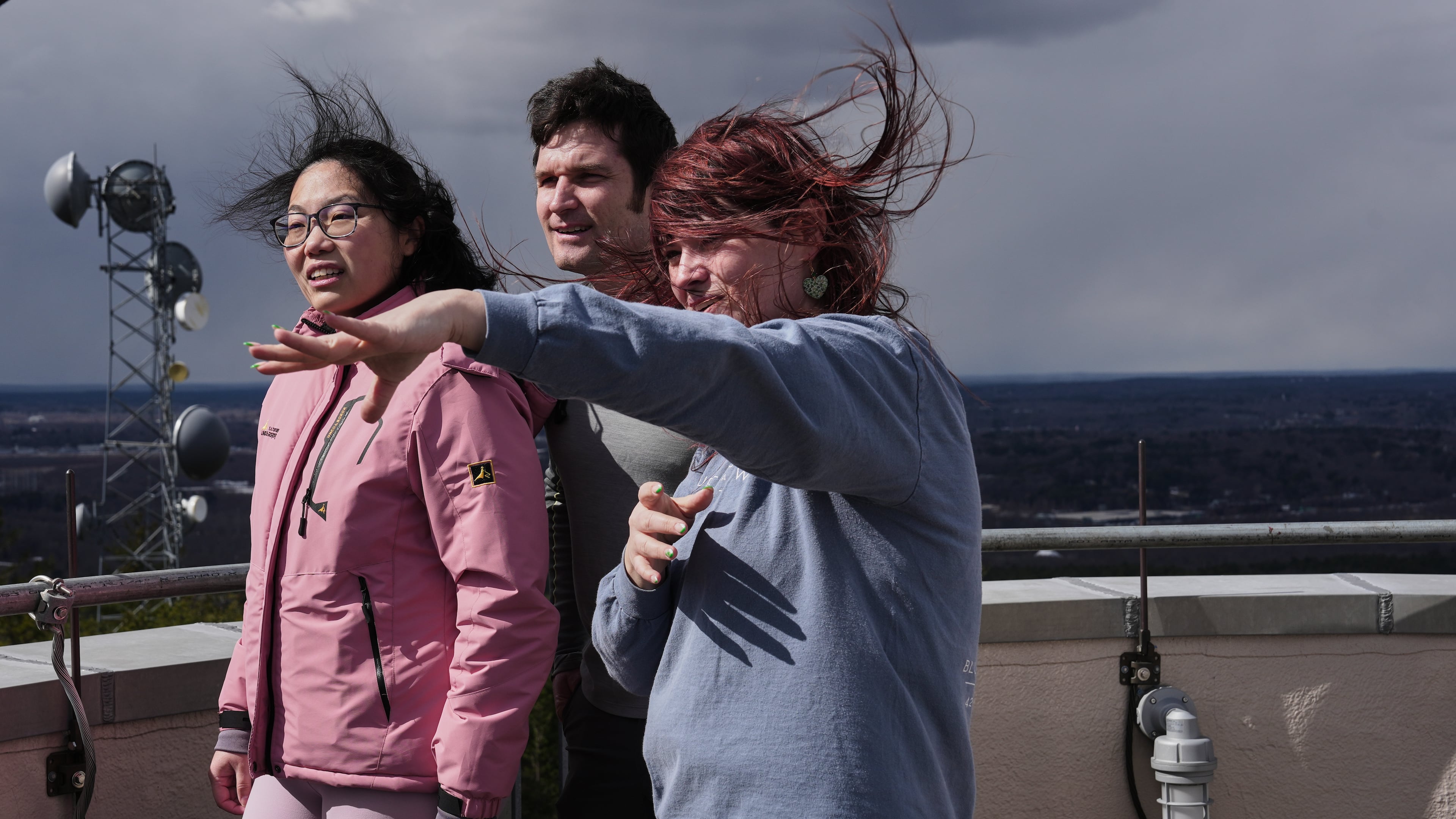 Amanda Joly, right, gives a tour to Naomi Jang, left, and Miles Abel, center, at the Blue Hill Observatory and Science Center, Saturday, March 14, 2026, in Milton, Mass. (Laura Martin Agudelo/MIT Graduate Program in Science Writing via AP)
