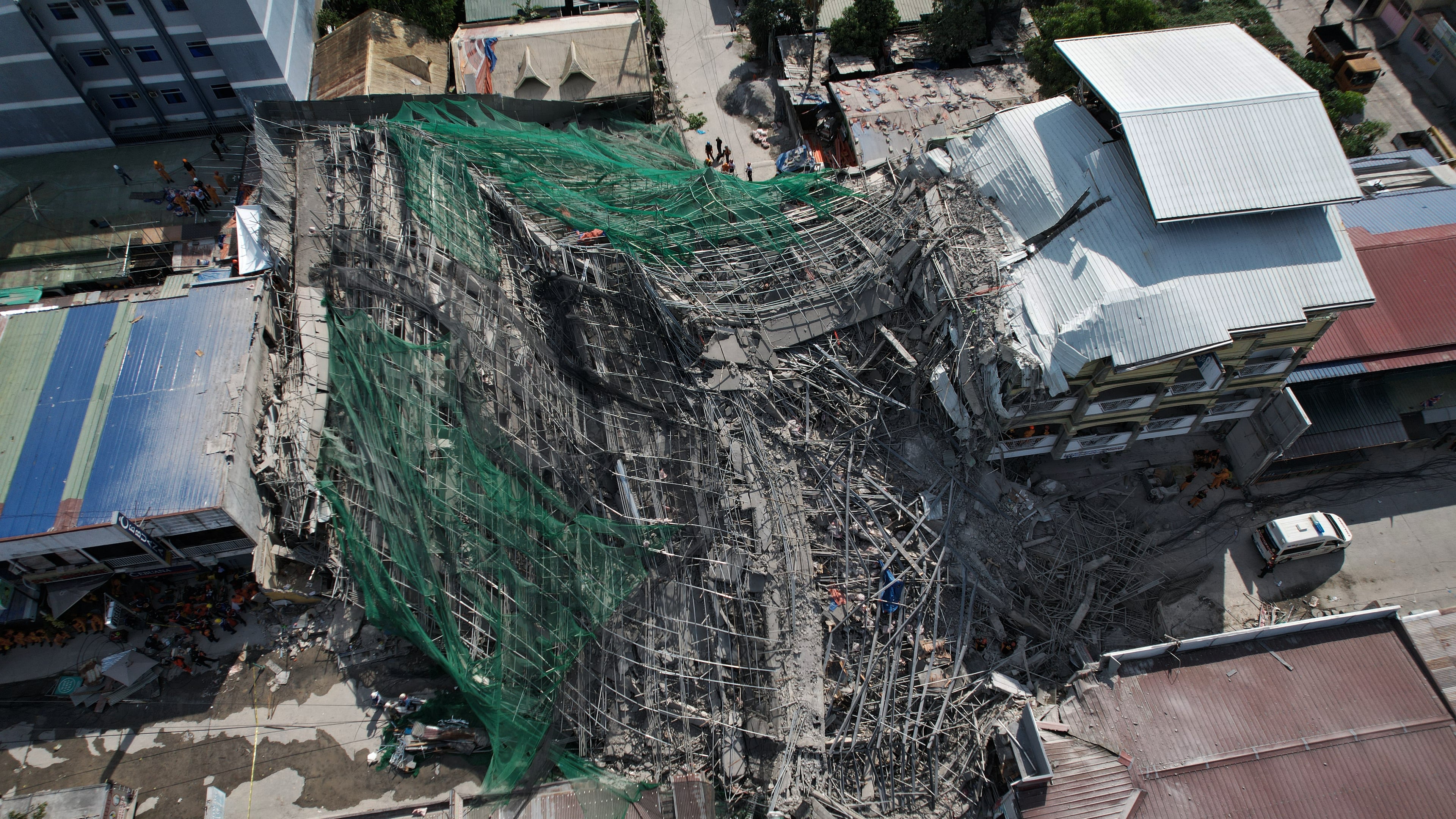 A collapsed building where multiple people are believed to be trapped in Angeles city in Pampanga province, north of Manila, Philippines Sunday, May 24, 2026. (AP Photo/Aaron Favila)
