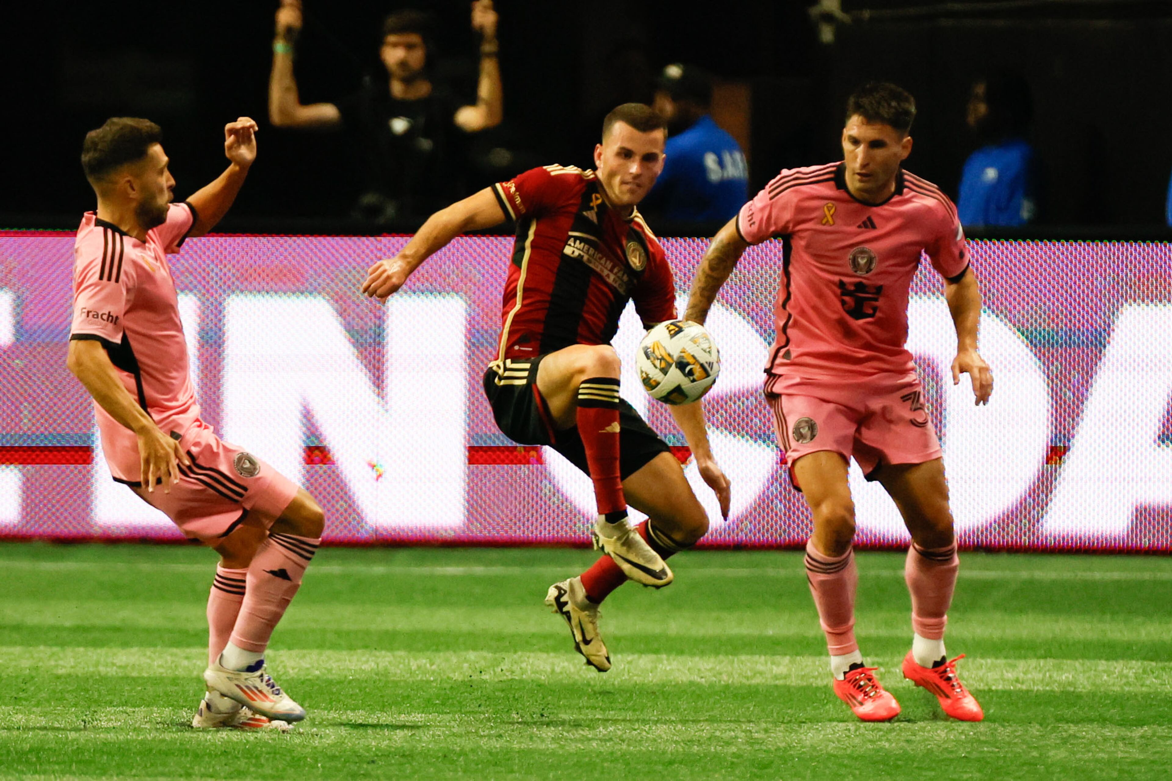 Atlanta United defender Brooks Lennon (11) disputes the ball against Inter Miami defenders during the second half.
(Miguel Martinez/ AJC)