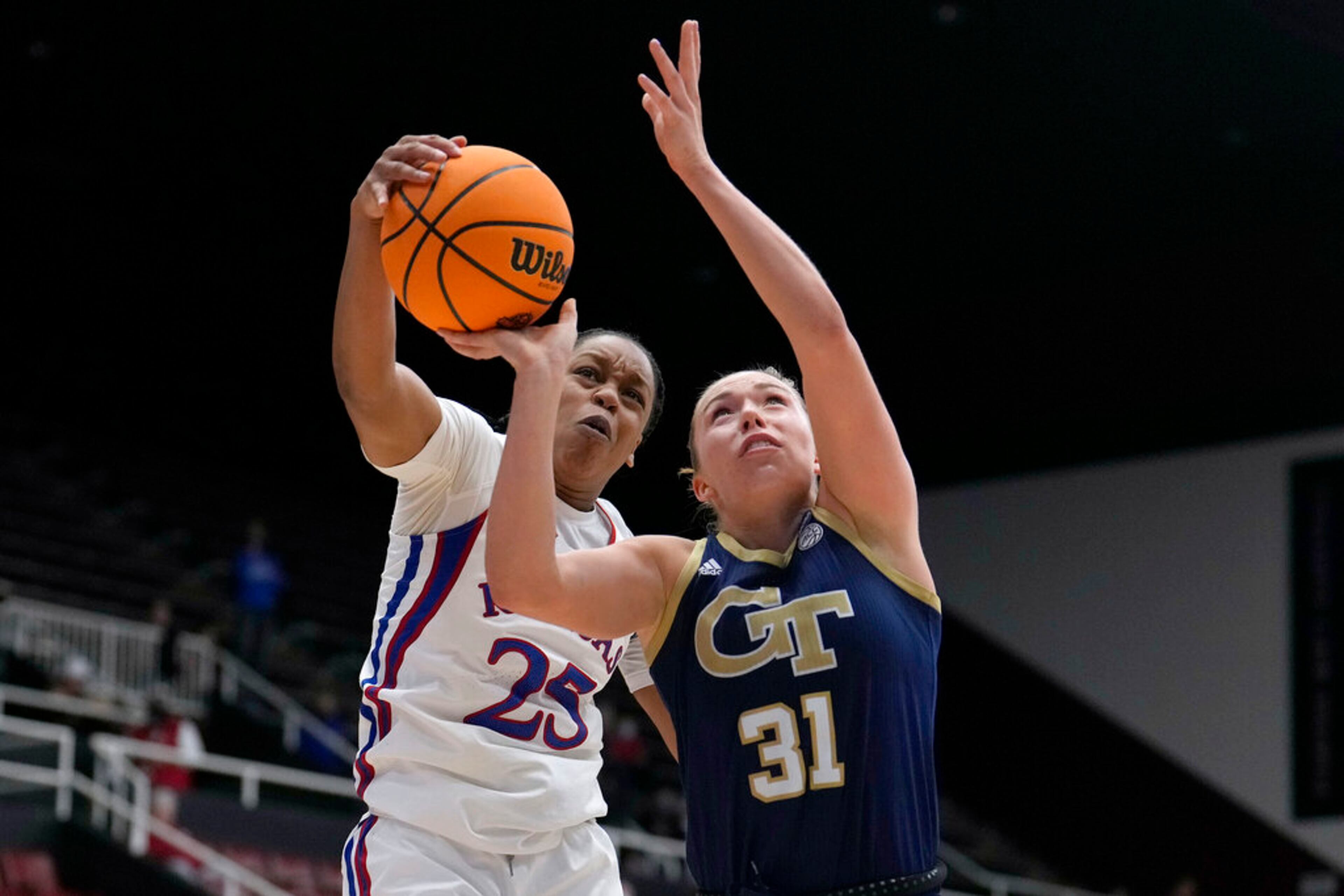 Kansas guard Chandler Prater (25) blocks a shot by Georgia Tech guard Lotta-Maj Lahtinen (31) during the second half of a first-round game in the NCAA women's college basketball tournament Friday, March 18, 2022, in Stanford, Calif. Kansas won the game 77-58. (AP Photo/Tony Avelar)