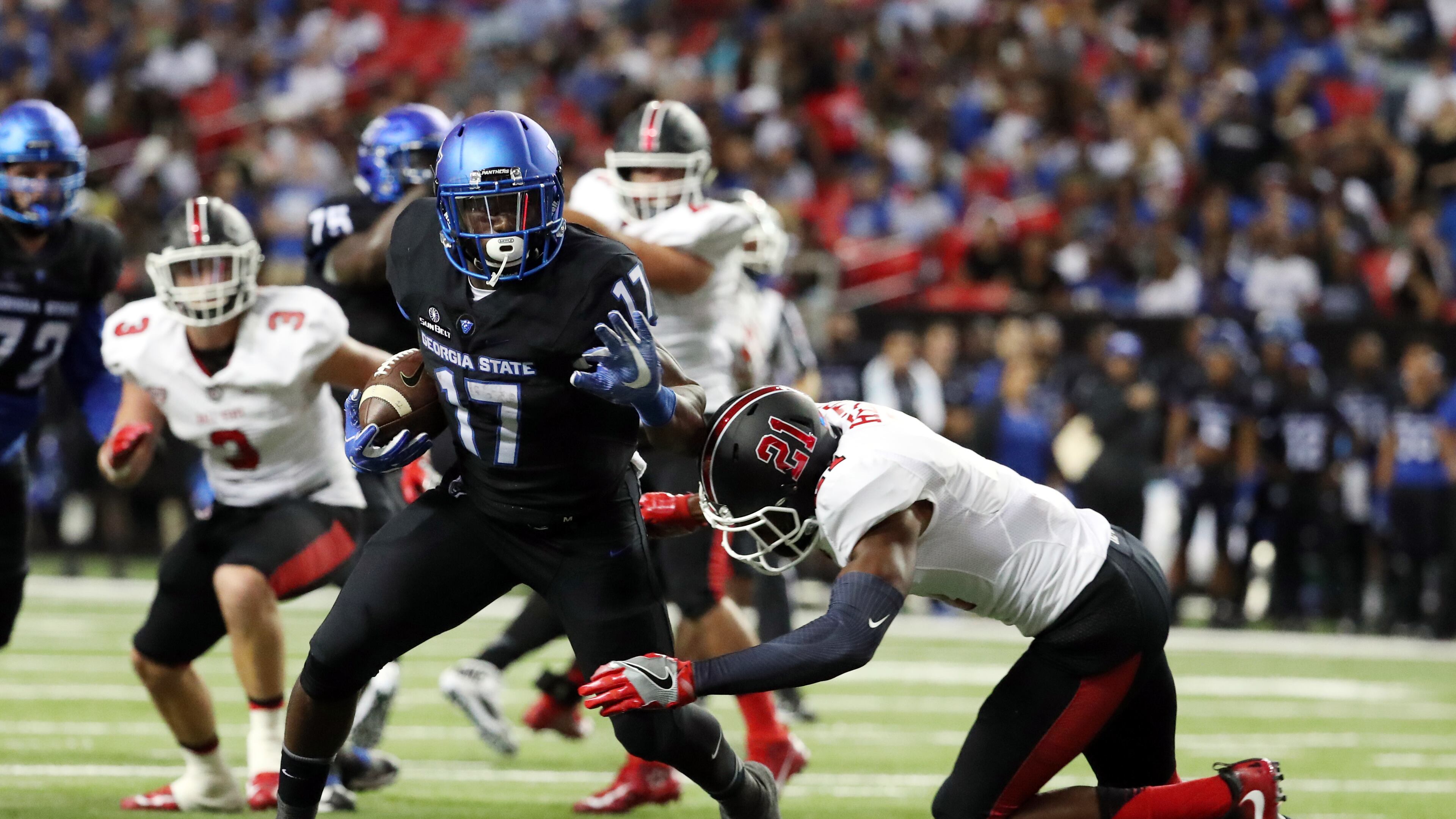 Georgia State running back Glenn Smith (17) runs after a catch against Ball State strong safety Martez Hester (21) in the first quarter of their game at the Georgia Dome, Friday, September, 2016, in Atlanta, Ga. PHOTO / JASON GETZ