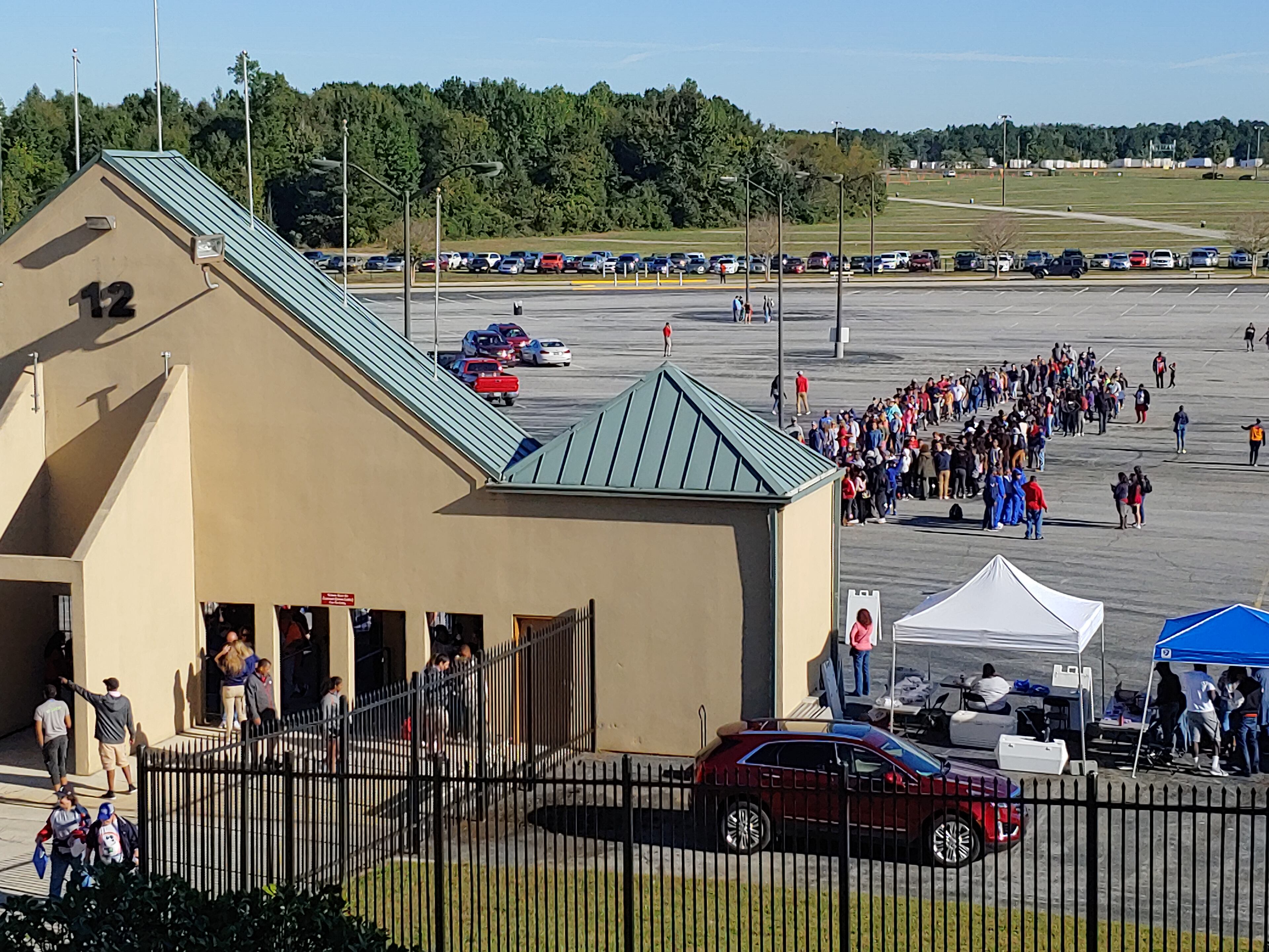 Crowds line up at the Atlanta Motor Speedway for the first day of the Atlanta Air Show on Saturday, Oct. 13, 2018.
