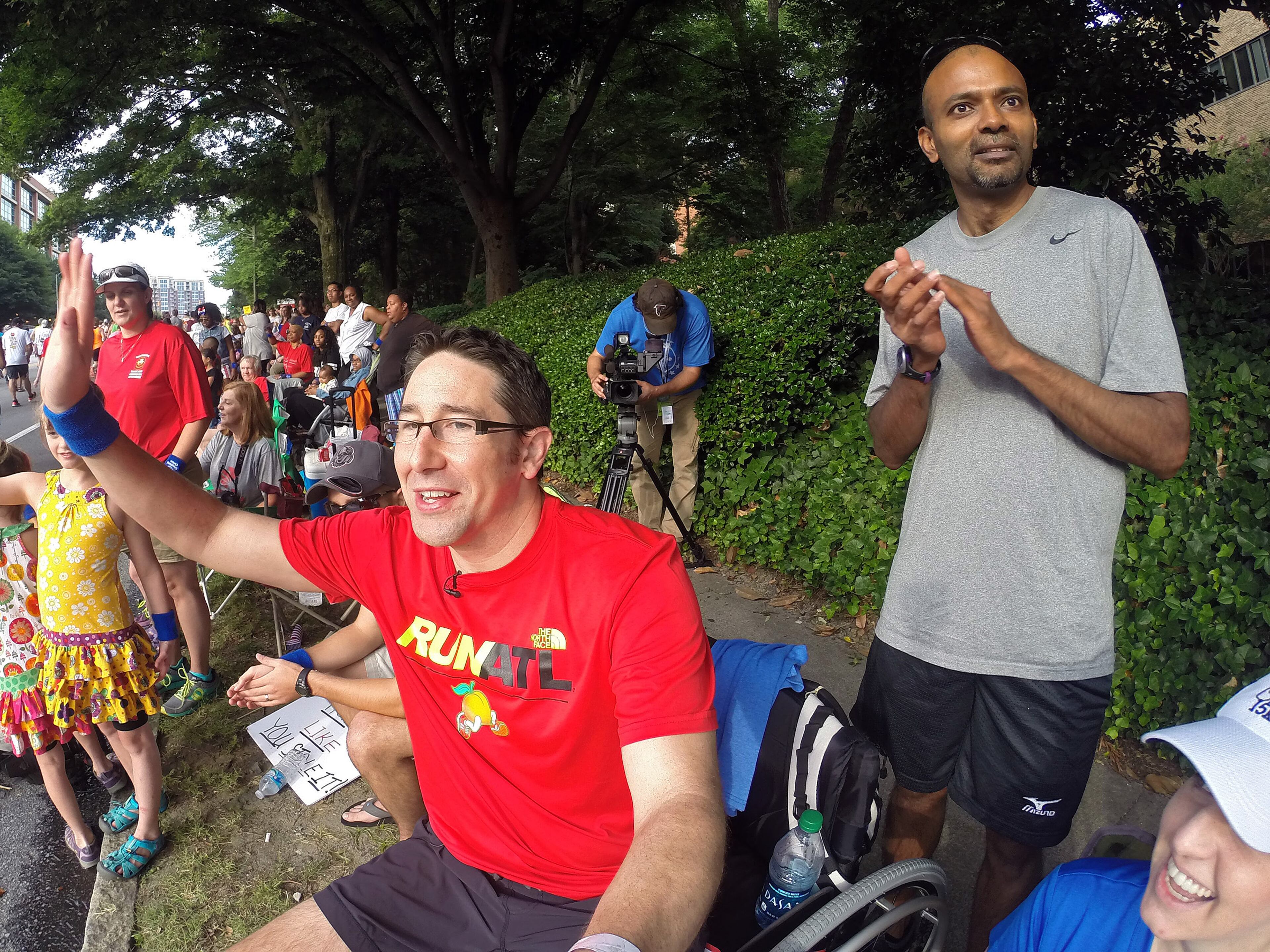 For most people, the AJC Peachtree Road Race is all about getting out and having fun with 60,000 other revelers. With that in mind, AJC Photojournalist Ben Gray passed a camera to runners as he made his way South on Friday morning July 4, 2014 and shot "selfies" of the runners as they carried the camera. BEN GRAY / BGRAY@AJC.COM