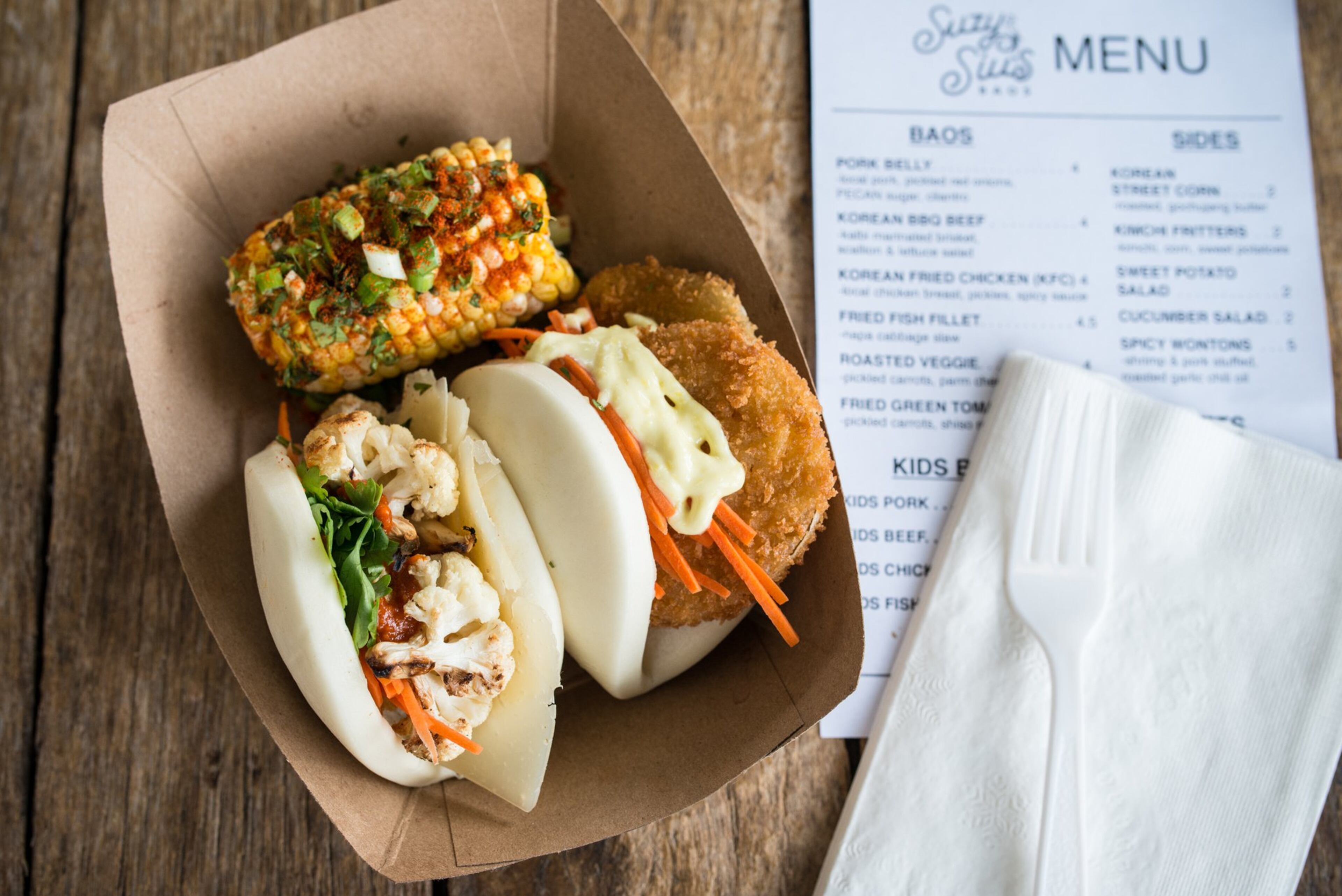Roasted Veggie and Fried Green Tomato baos with Korean Street Corn. Photo credit- Mia Yakel.