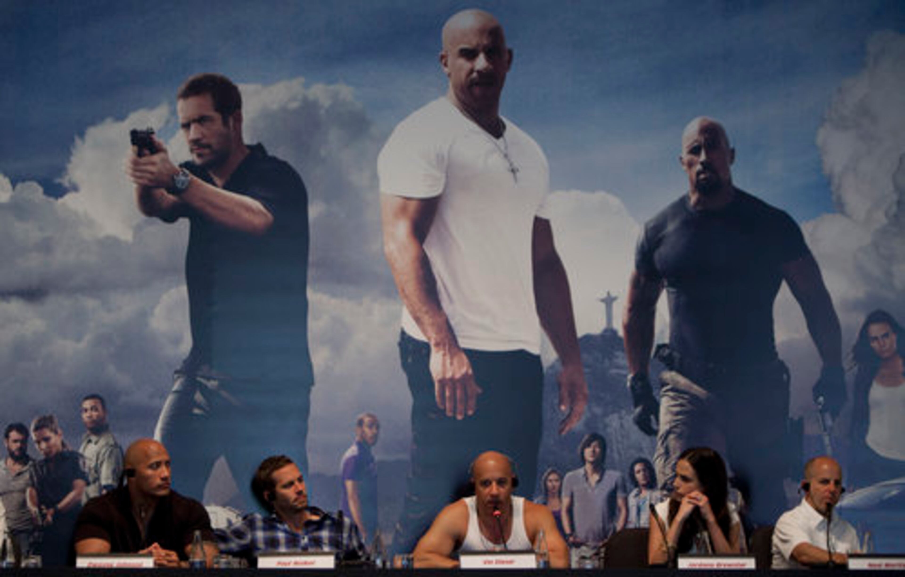 Actors from the film "Fast Five," from left, Dwayne Johnson, Paul Walker, Vin Diesel, Jordana Brewster and producer Neal Moritz, give a press conference promoting their movie in Rio de Janeiro, Brazil, Wednesday April 13, 2011. The movie reunites Walker, Diesel and Brewster, who were in previous "The Fast and the Furious" films.