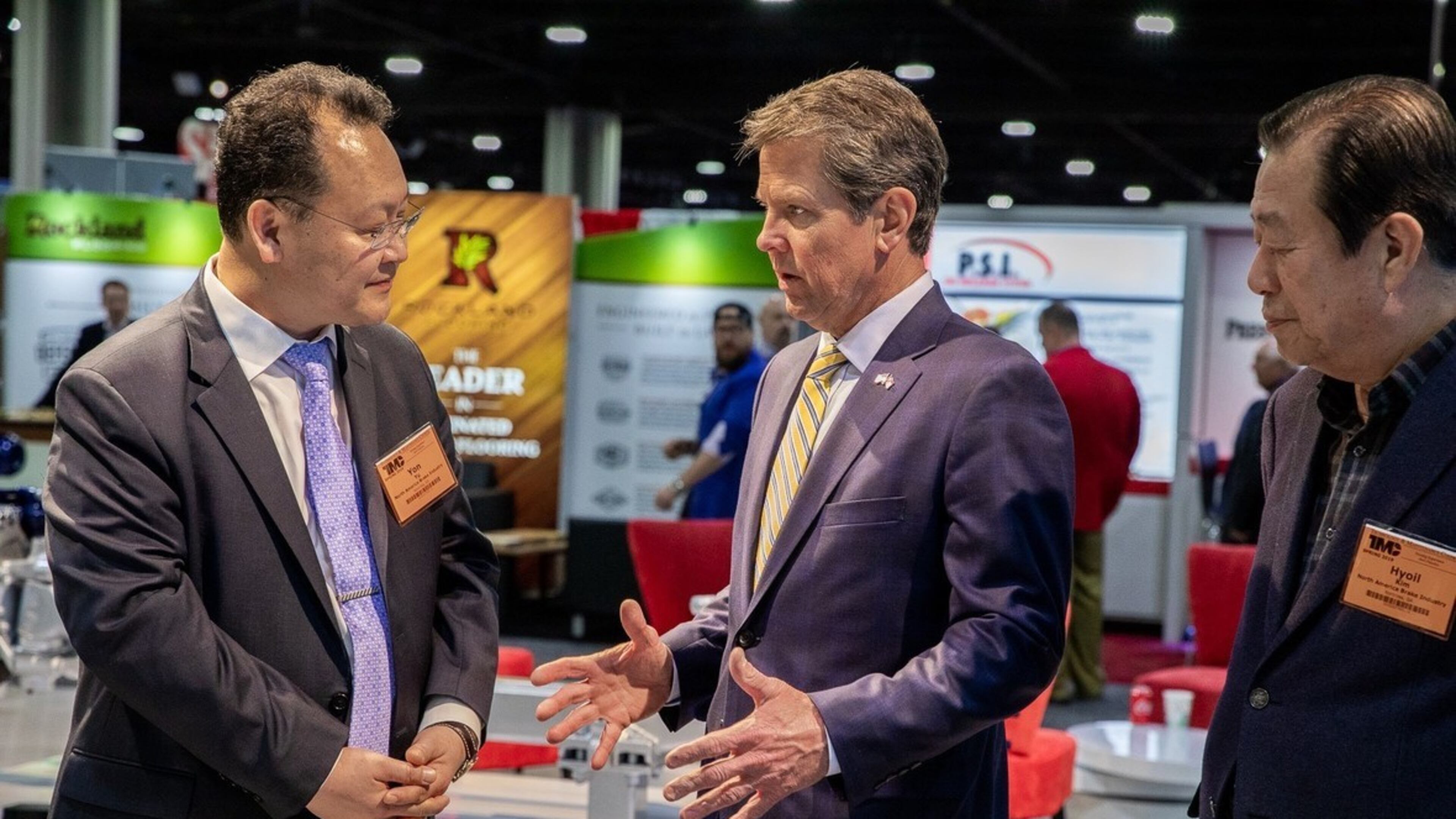 Gov. Brian Kemp speaks representatives of Sangsin Technology America, which is bringing 200 jobs to McDonough. PHOTO: OFFICE OF GOV. BRIAN KEMP