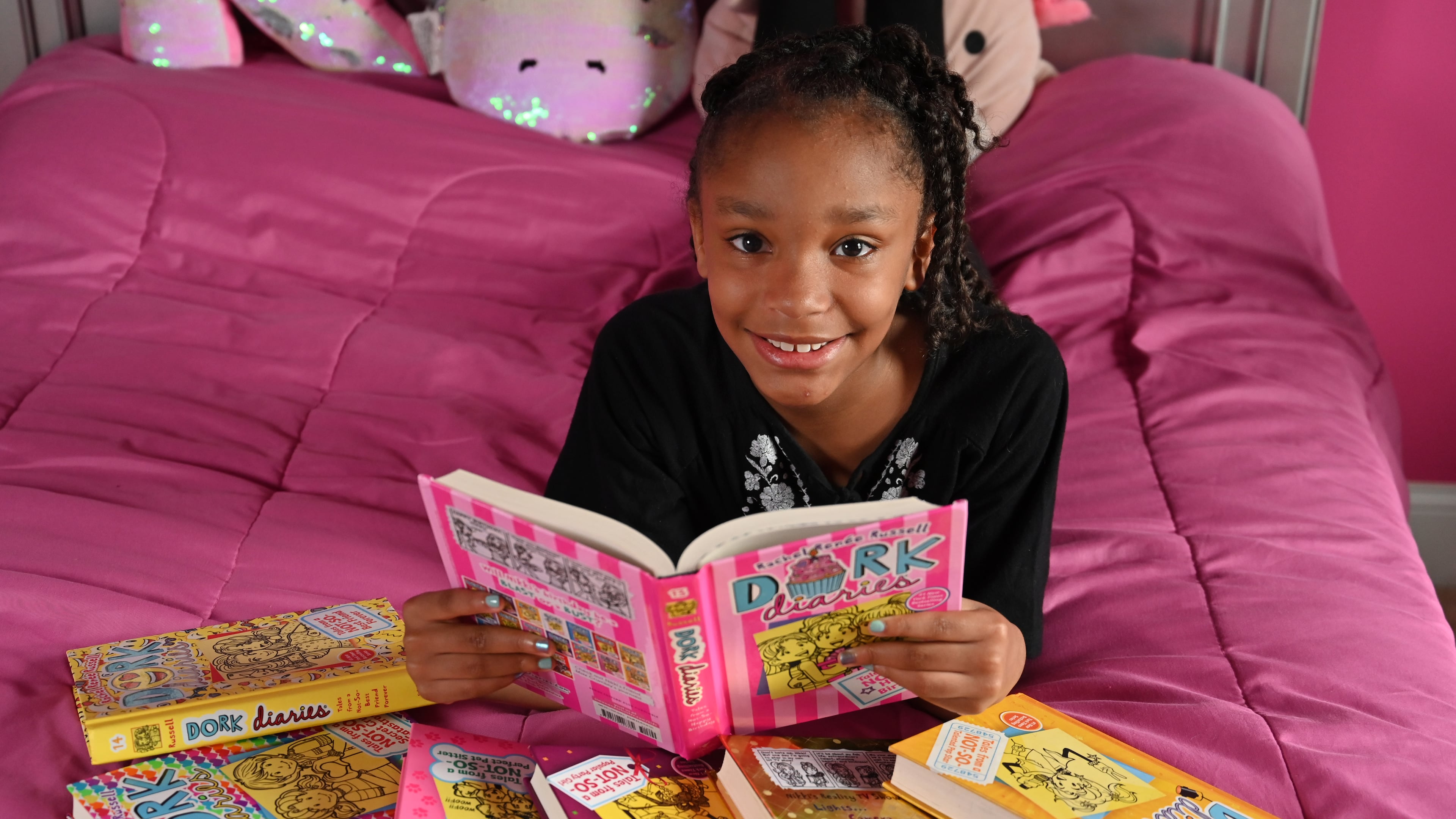 September 9, 2020 Fairburn - Portrait of Khloe Livsey, 9, an avid reader of Dork Diaries, in her room on Wednesday, September 9, 2020. (Hyosub Shin / Hyosub.Shin@ajc.com)
