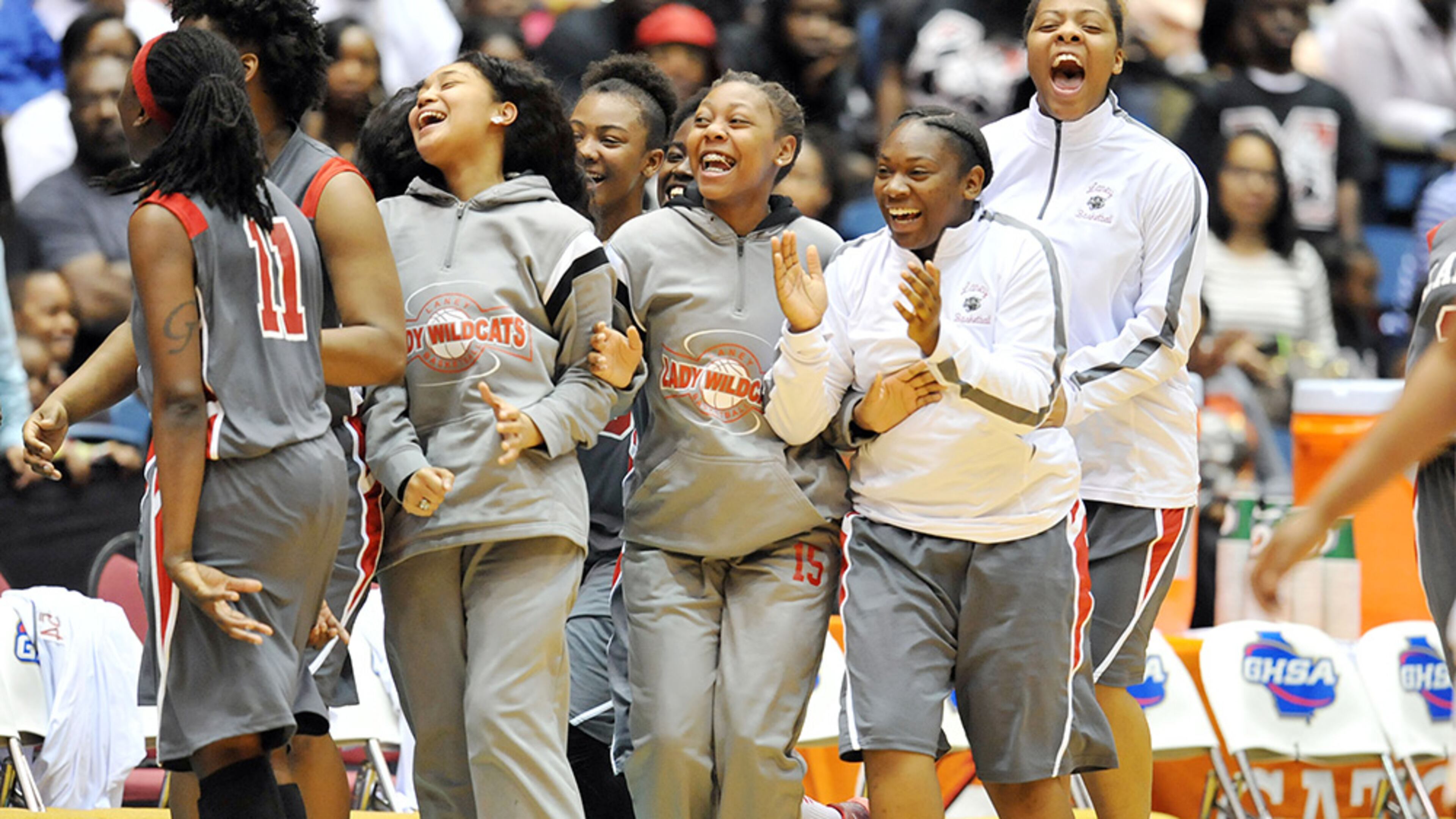 Laney Wildcats players celebrate as time expires in their win of the 2015 Class AAA girls state championship. (Kent D. Johnson/AJC)