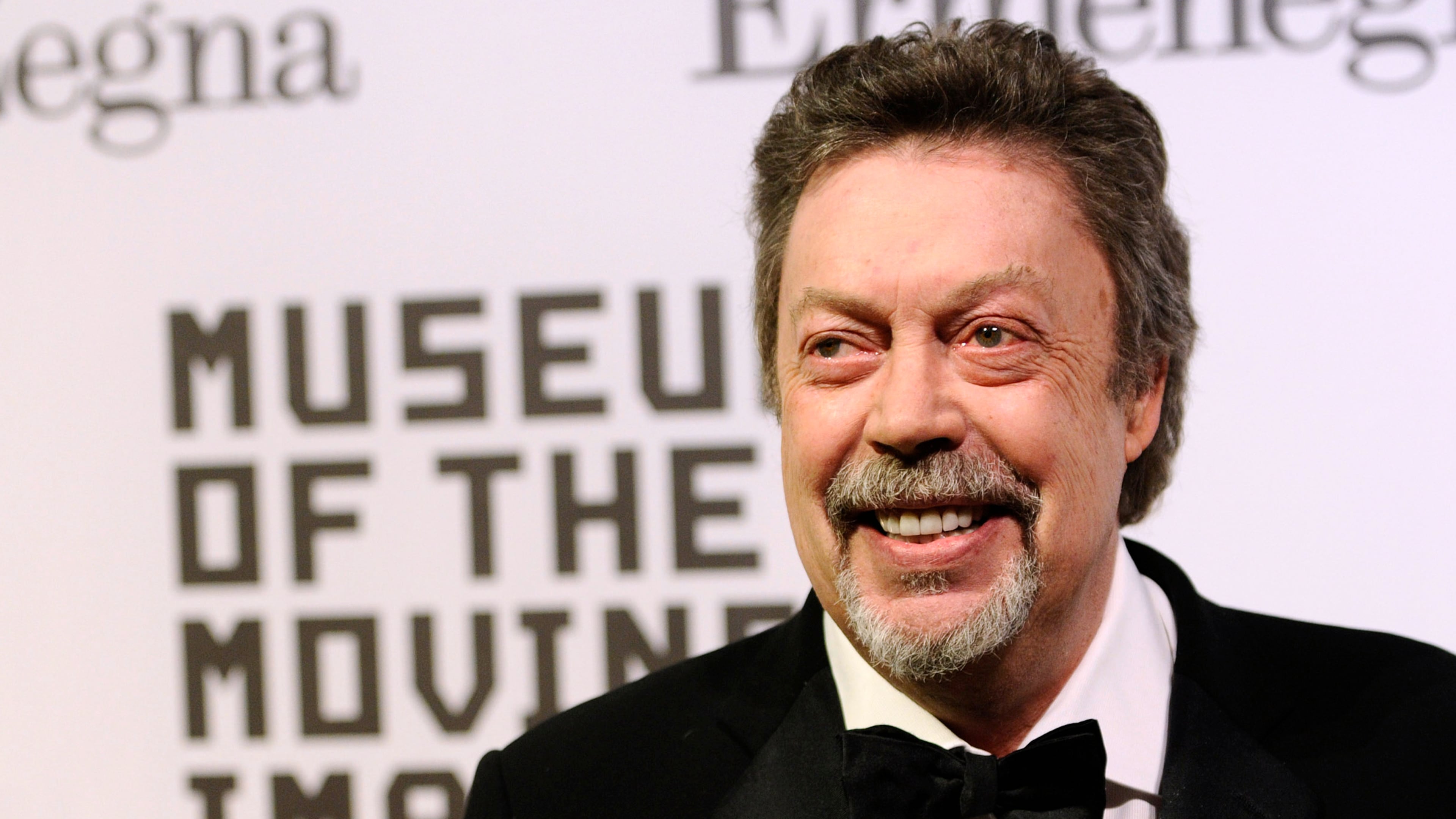 FILE - Tim Curry attends the Museum of the Moving Image salute to Alec Baldwin in New York on Feb. 28, 2011. (AP Photo/Peter Kramer, File)