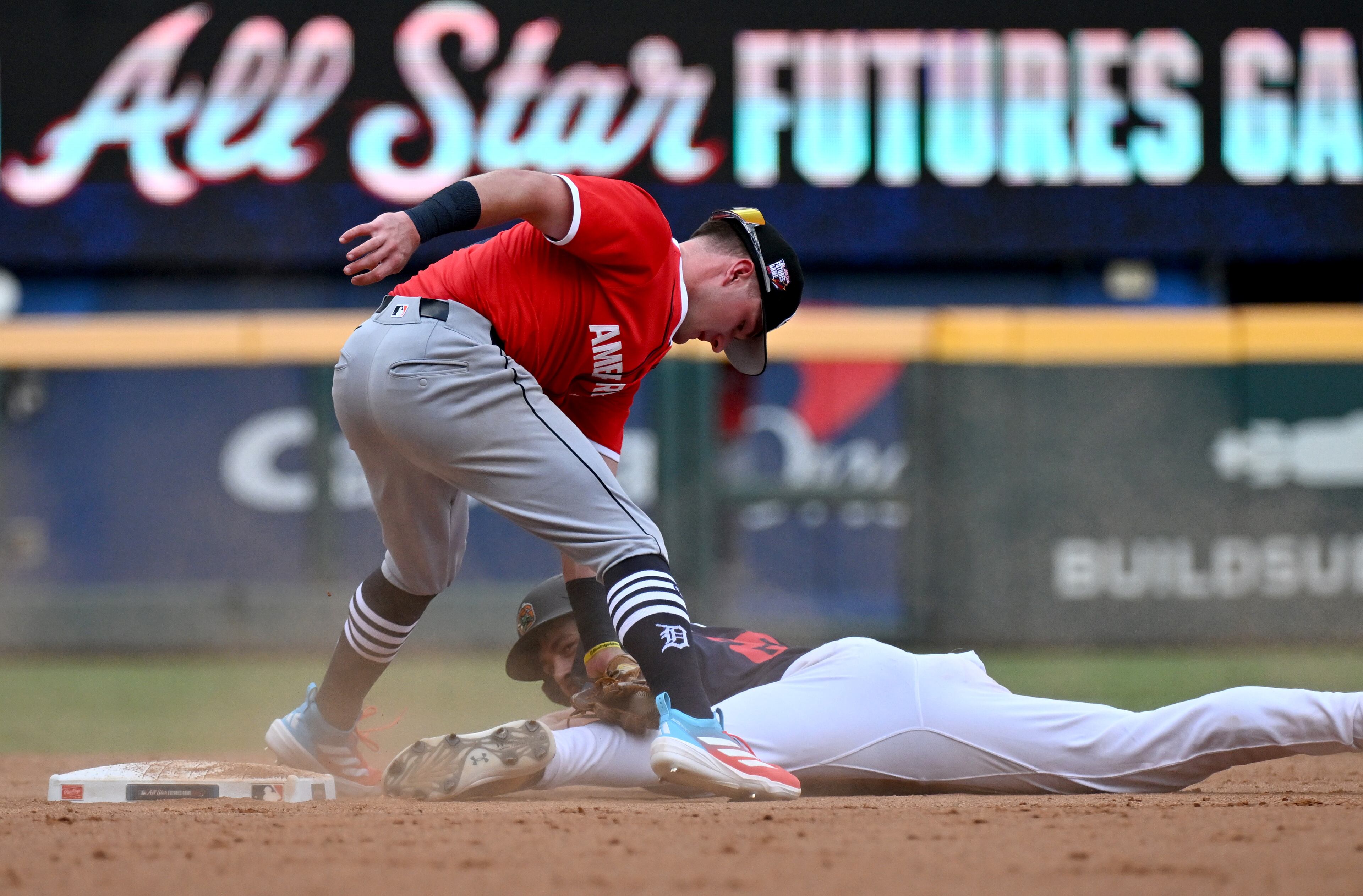 American League second baseman Kevin McGonigle (7) tags out National League infielder Konnor Griffin (22) during the third inning of the All-Star Futures Game at Truist Park, Saturday, July 12, 2025, in Atlanta. National League won 4-2 over American League. (Hyosub Shin / AJC)