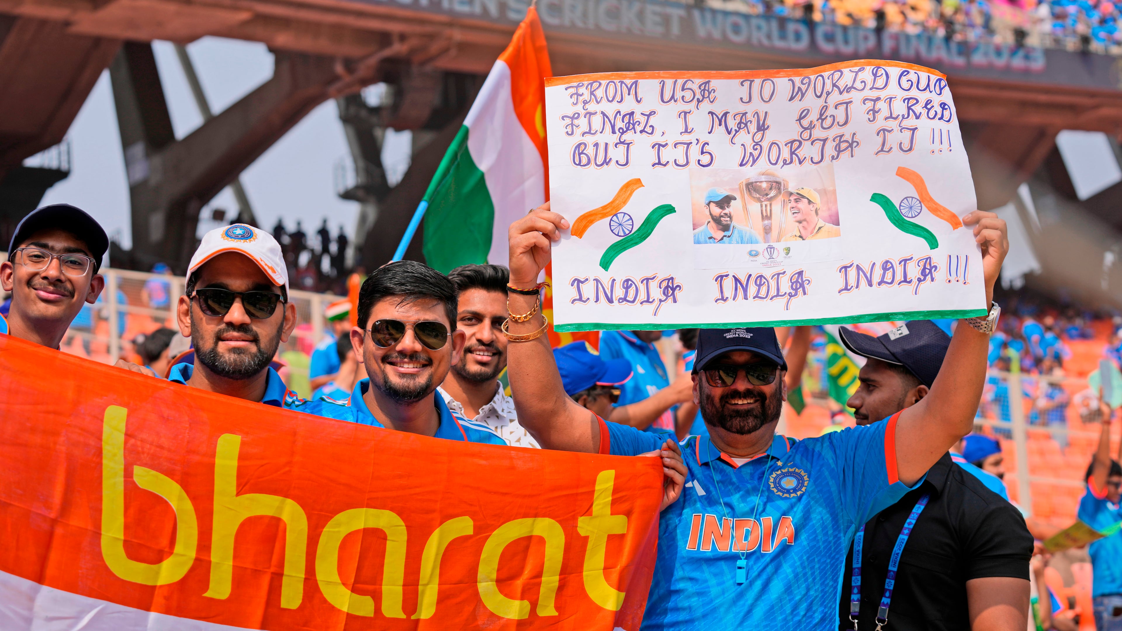 FILE - Indian cricket fans cheer holding banners and posters as they arrive at the stadium hours before the start of the ICC Men's Cricket World Cup final match between India and Australia in Ahmedabad, India, Sunday, Nov.19, 2023. (AP Photo/Aijaz Rahi,File)