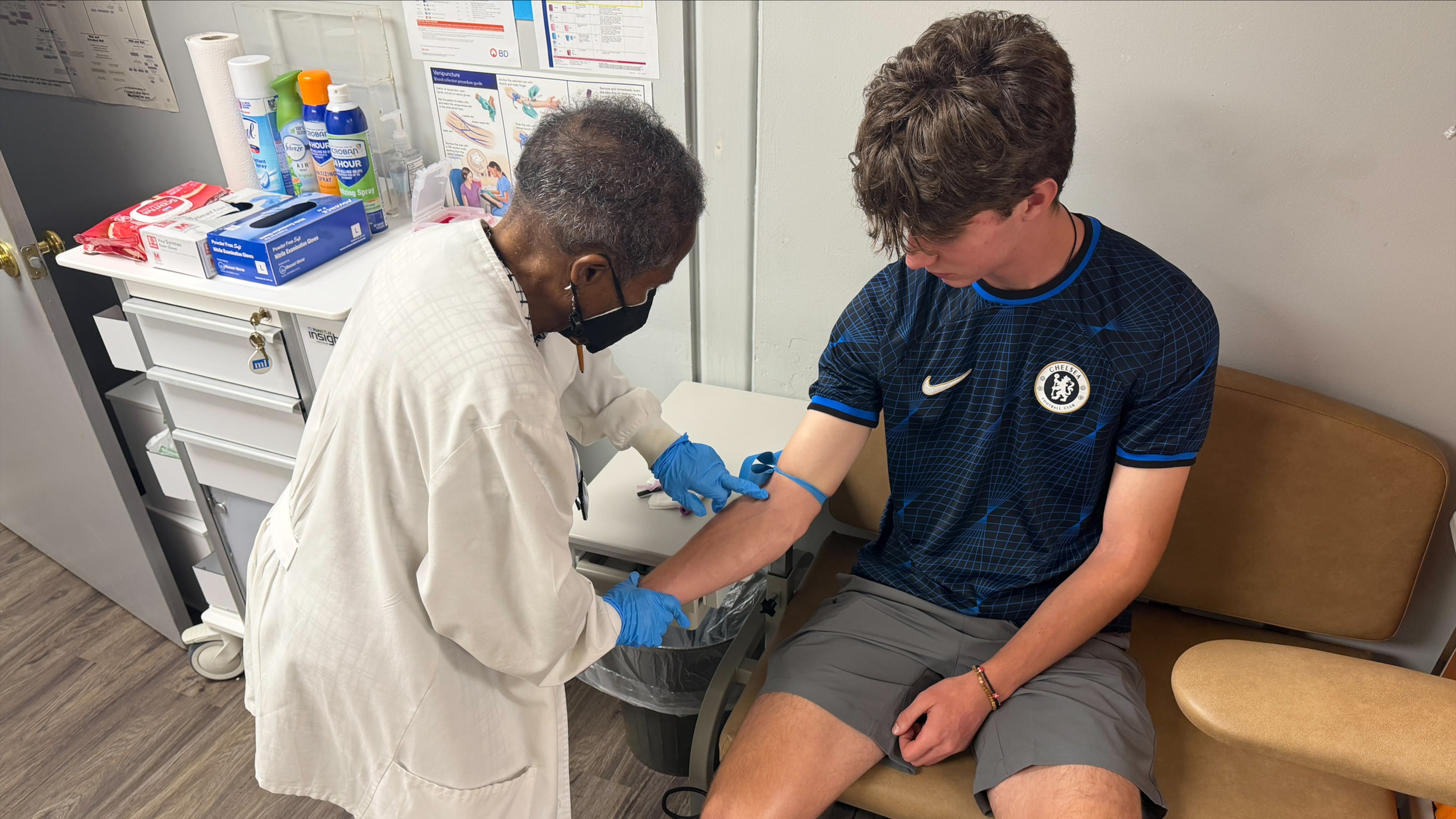 Jackie George, the Sickle Cell Foundation of Georgia, Inc.'s certified hemoglobinopathy counselor, attends to a patient. (Courtesy)
