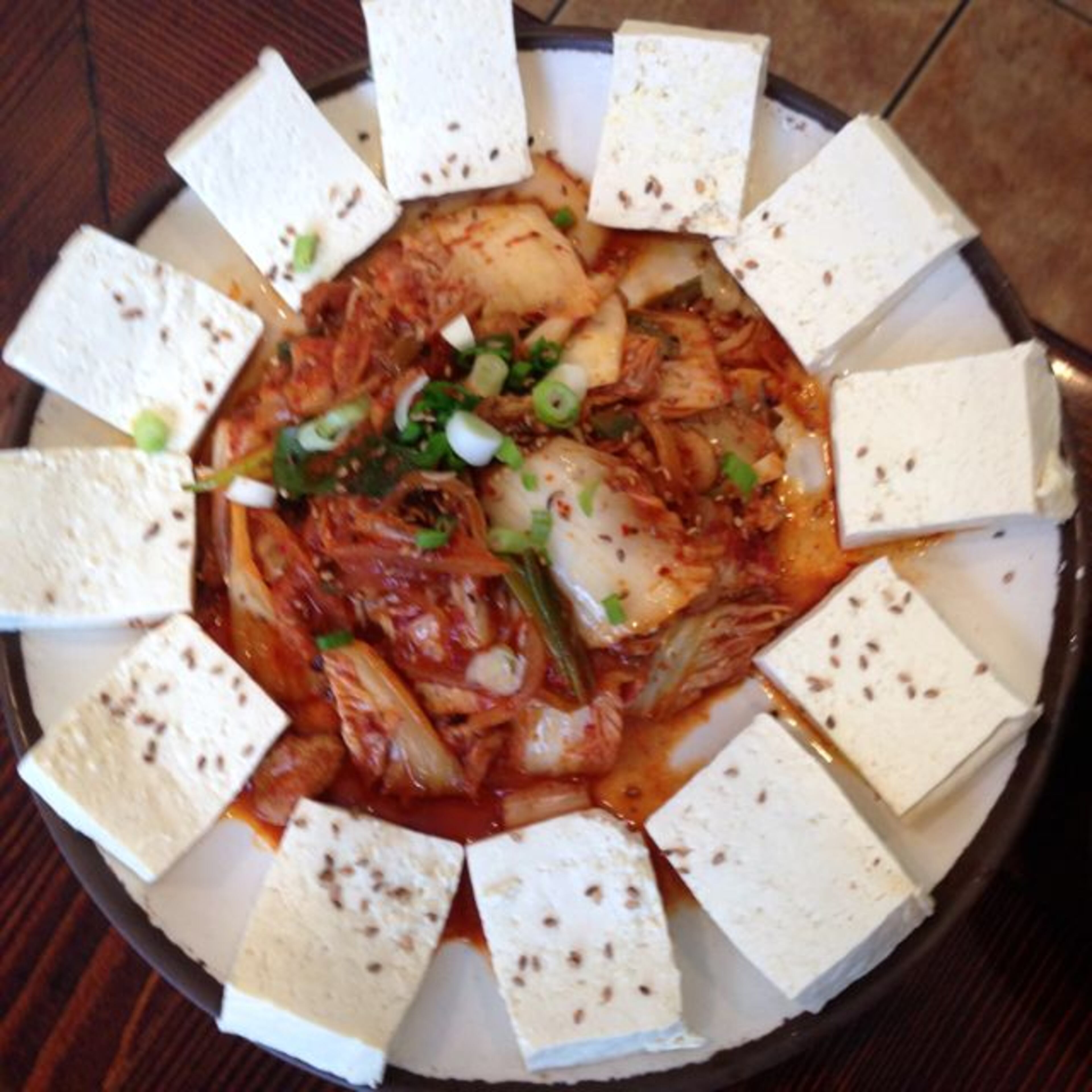 "The pork-and-kimchi stir fry is a revelation. Fatty slips of pork have a photo-filter mellowing effect on the sharp, salty tang of fermented cabbage, transforming it into a new flavor. It’s like a perfectly made salade frisée aux lardons; every drop of fat goes to good use."