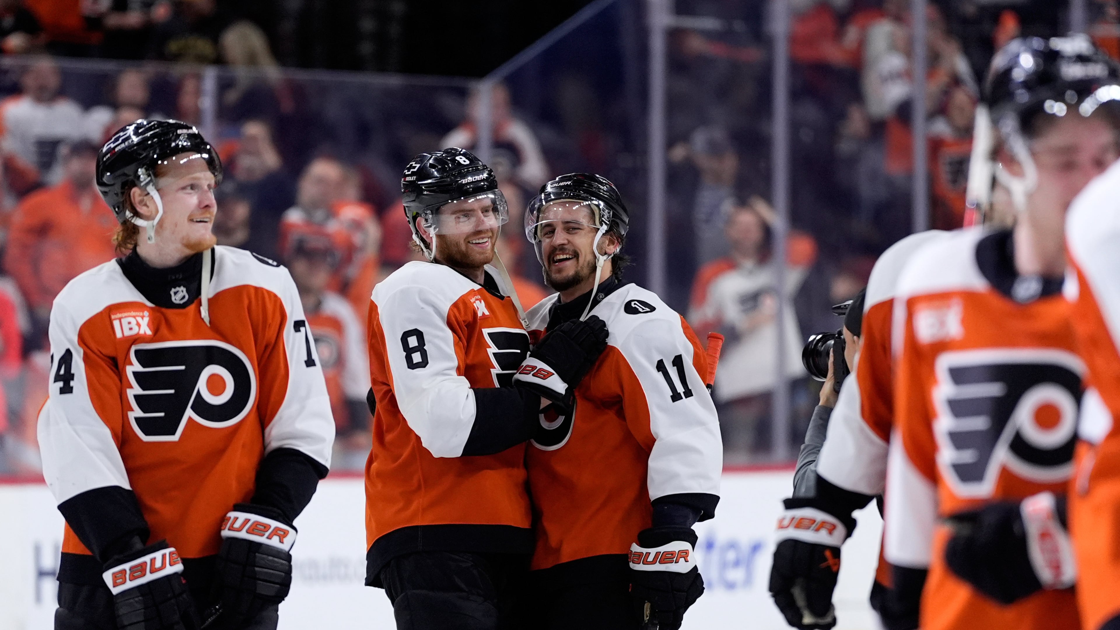 Philadelphia Flyers' Cam York (8) and Travis Konecny (11) celebrate after the Flyers won Game 6 against the Pittsburgh Penguins in the first round of the NHL hockey Stanley Cup playoffs series Wednesday, April 29, 2026, in Philadelphia. (AP Photo/Matt Slocum)