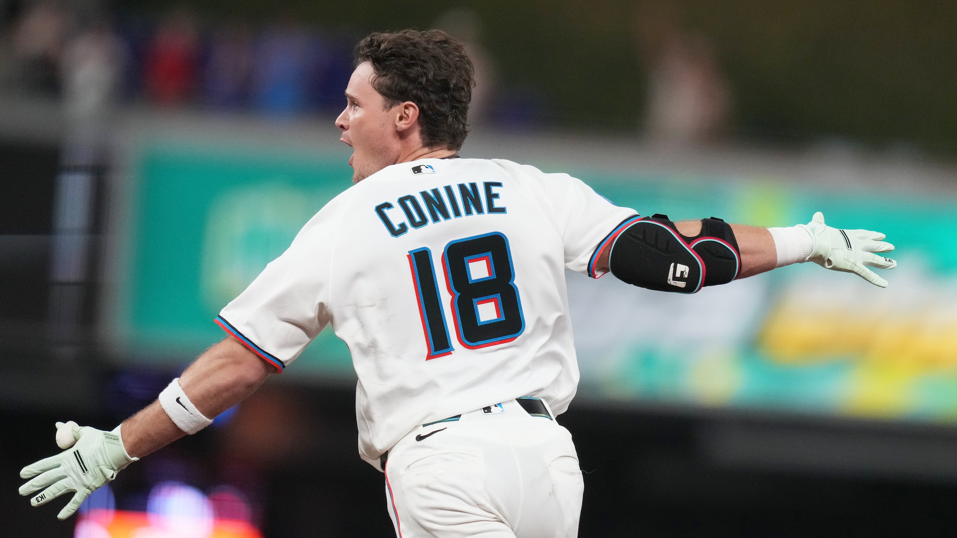 Miami Marlins' Griffin Conine (18) reacts after hitting a walk off single to score Heriberto Hernández and defeat the Philadelphia Phillies in the the ninth inning of a baseball game, Monday, July 27, 2026, in Miami. (AP Photo/Lynne Sladky)