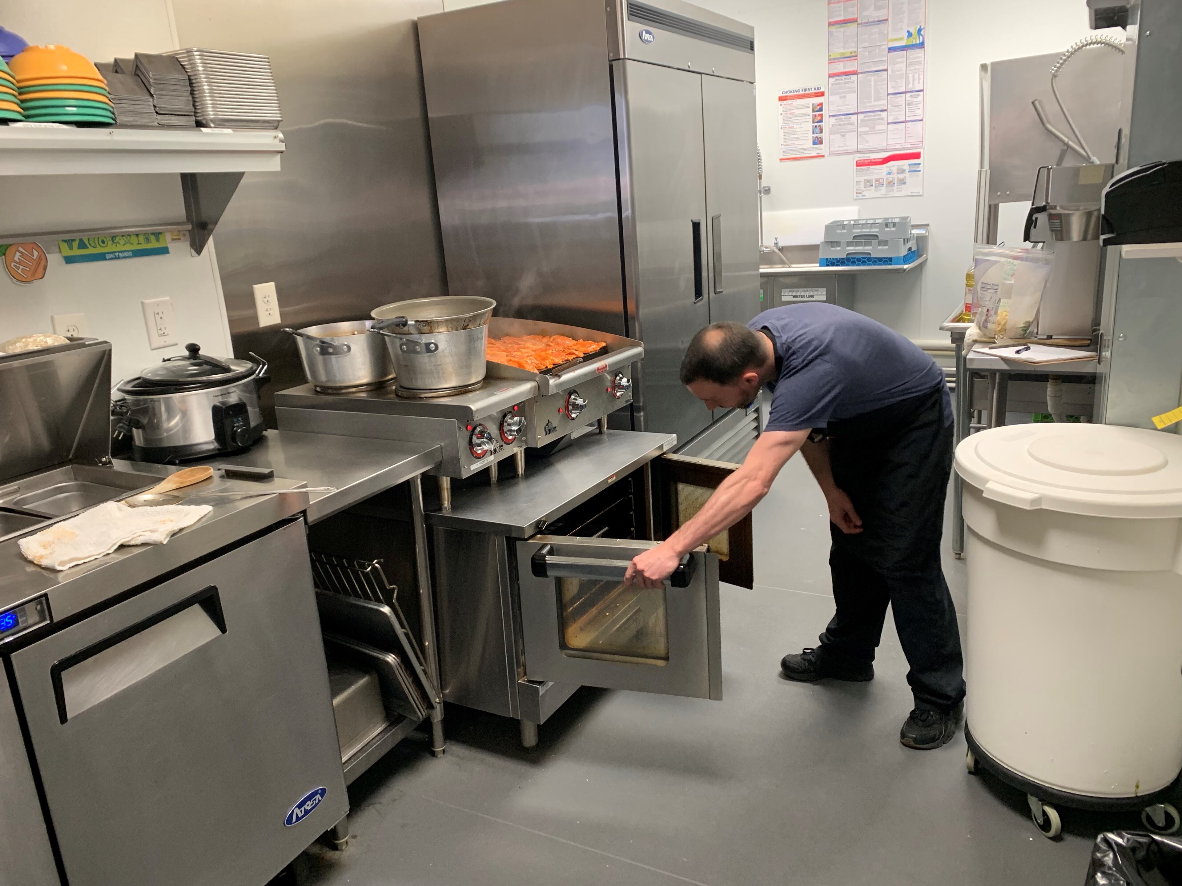 Guac y Margys sous chef Matt Sherwood works the cooking units at full capacity. "The space wasn't initially intended to be a restaurant," said executive chef Sebastian Romano of the tight quarters in the new spot near the eastside Beltline.