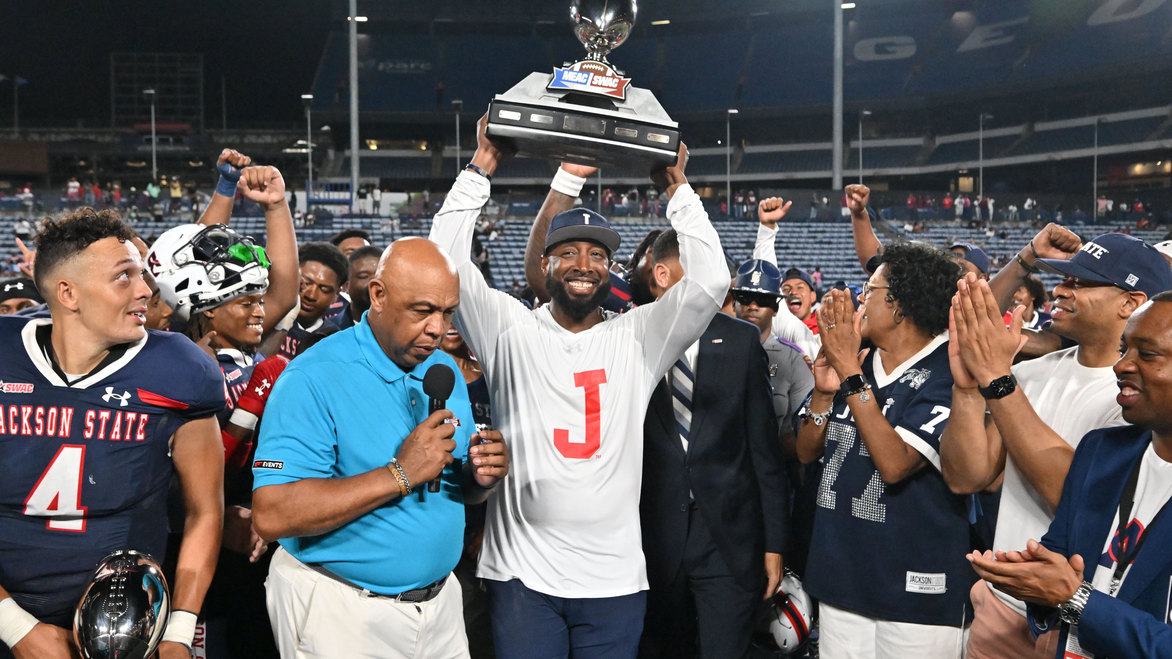Jackson State's head coach T.C. Taylor holds up the trophy to celebrates their victory during the 2023 MEAC/SWAC Challenge at Center Parc Stadium, Saturday, August 26, 2023, in Atlanta. The 2026 MEAC/SWAC Challenge will feature Howard and Alabama A&M. (Hyosub Shin/AJC)