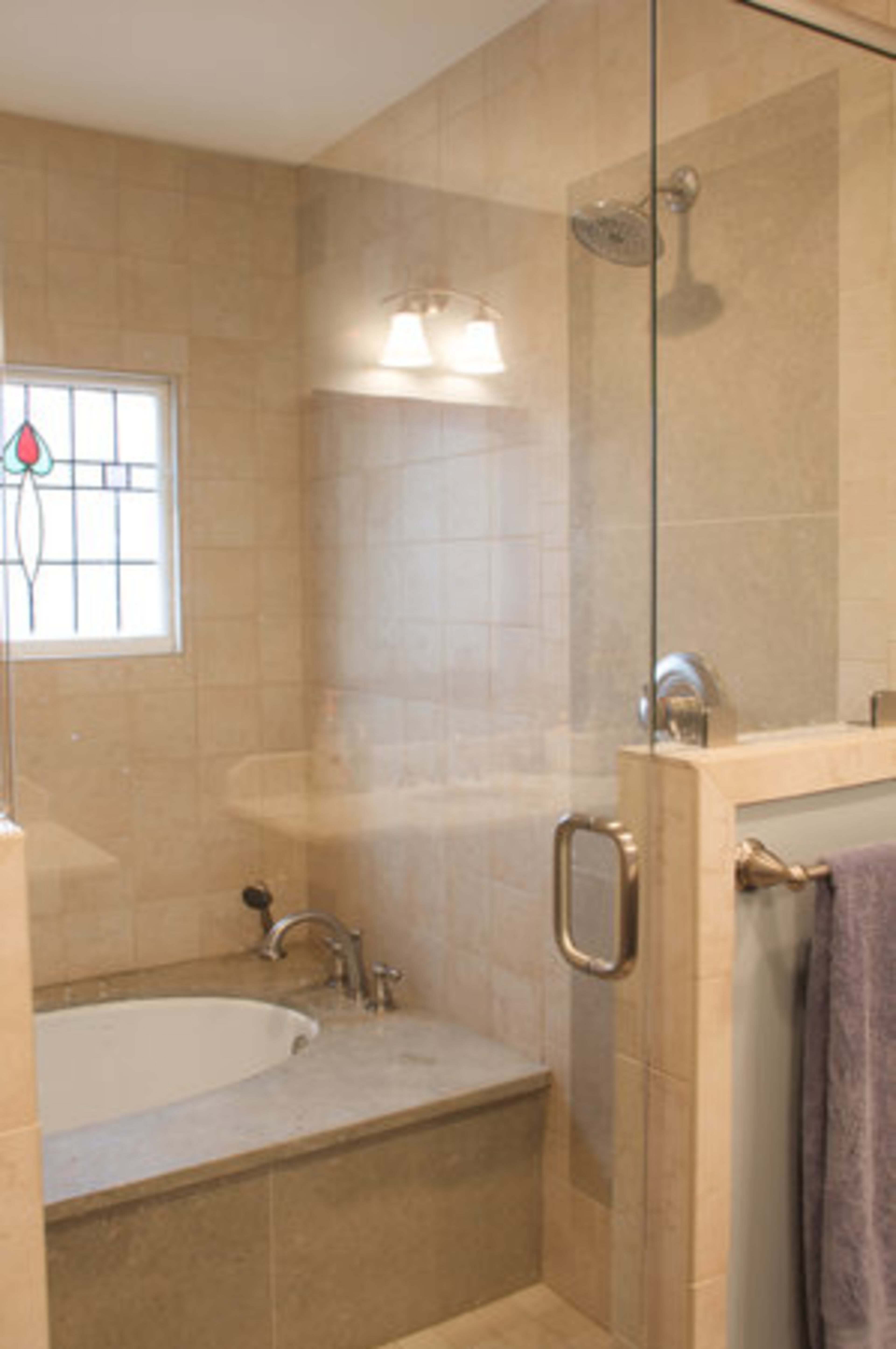 "The old master bath was just too small to support the amenities of a contemporary master bath, but it was the perfect size for the new master closet," says Jim Walker, owner of Copper Sky Renovations. "We had to open two existing closets to create the space for the new bathroom."