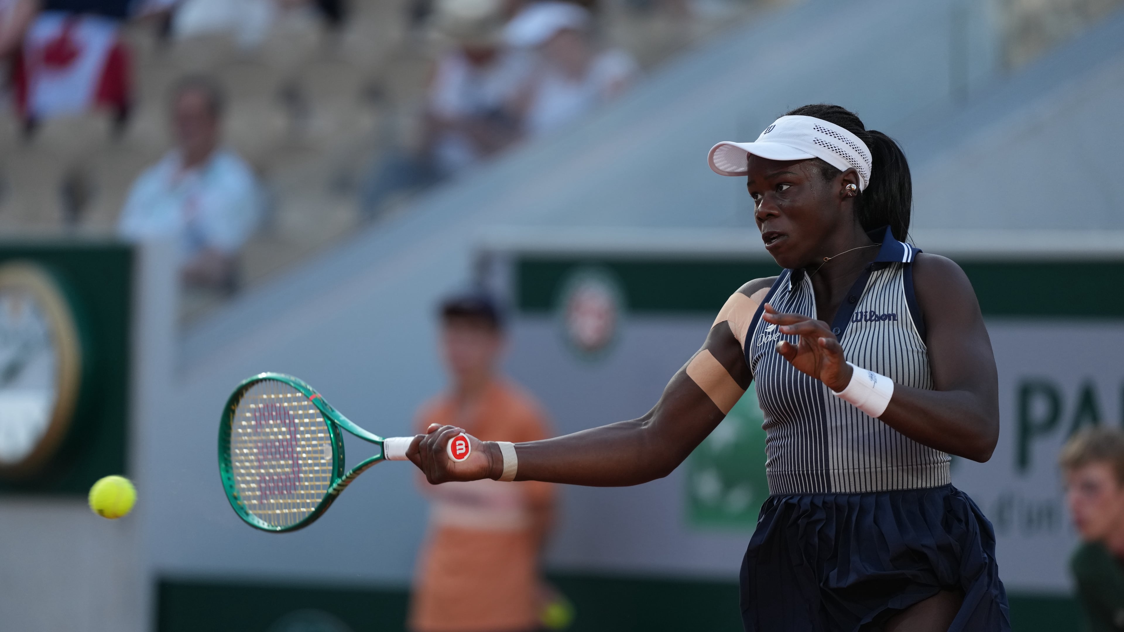 Victoria Mboko of Canada returns to Katerina Siniakova of the Czech Republic during their second round women's singles tennis match at the French Open tennis tournament in Paris, Thursday, May 28, 2026. (AP Photo/Thibault Camus)