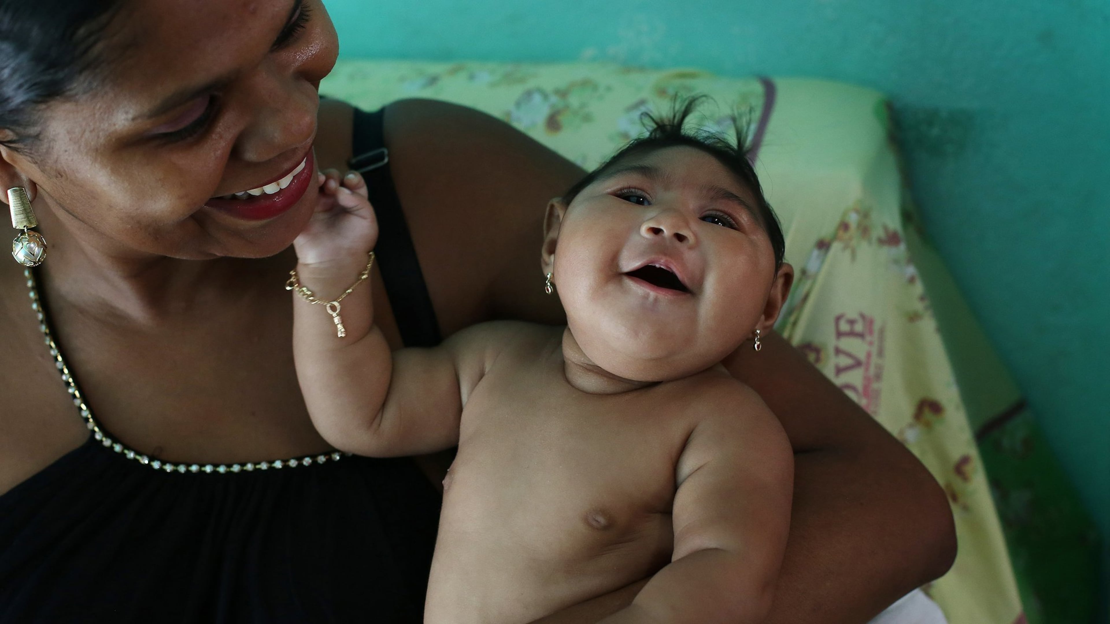 Maria da Luz Mendes Santos holds her daughter, Heloyse, who was born with microcephaly. Chinese researchers have pinpointed the single genetic change that has made the Zika virus a fearsome plague to pregnant women and their babies across the Americas, responsible for thousands of cases of microcephaly and other grievous brain abnormalities that sometimes result in death. (Katie Falkenberg/Los Angeles Times/TNS)