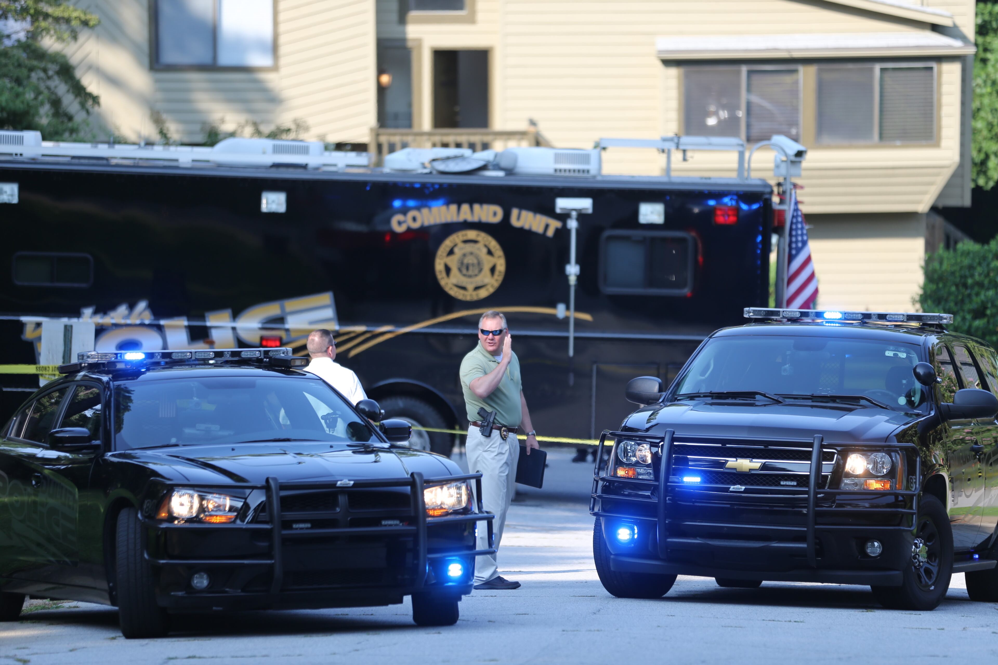 Duluth police are on the scene of a deadly home invasion in which a man was killed and a woman and child were shot and wounded. JOHN SPINK/JSPINK@AJC.COM