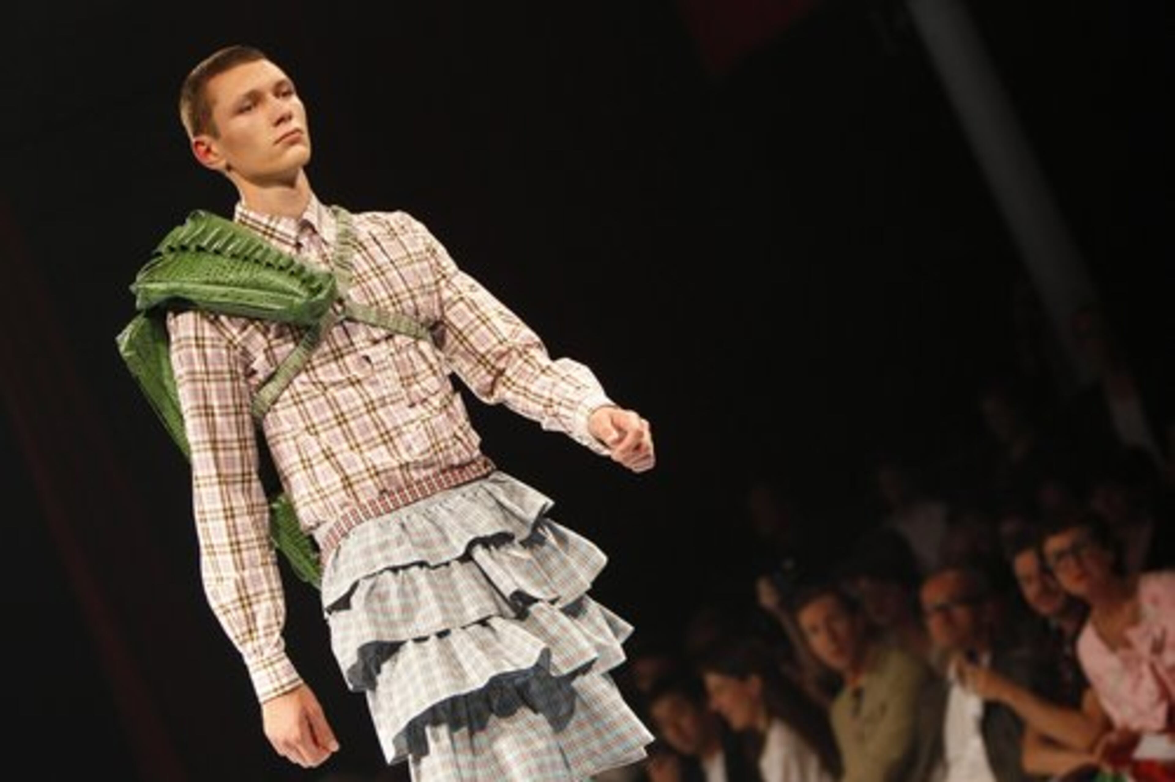 A model wears a creation by Belgium fashion designer Walter Van Beirendonck, along with an over-the-shoulder bag as part of the Men's Spring-Summer 2011 fashion collection in Paris.