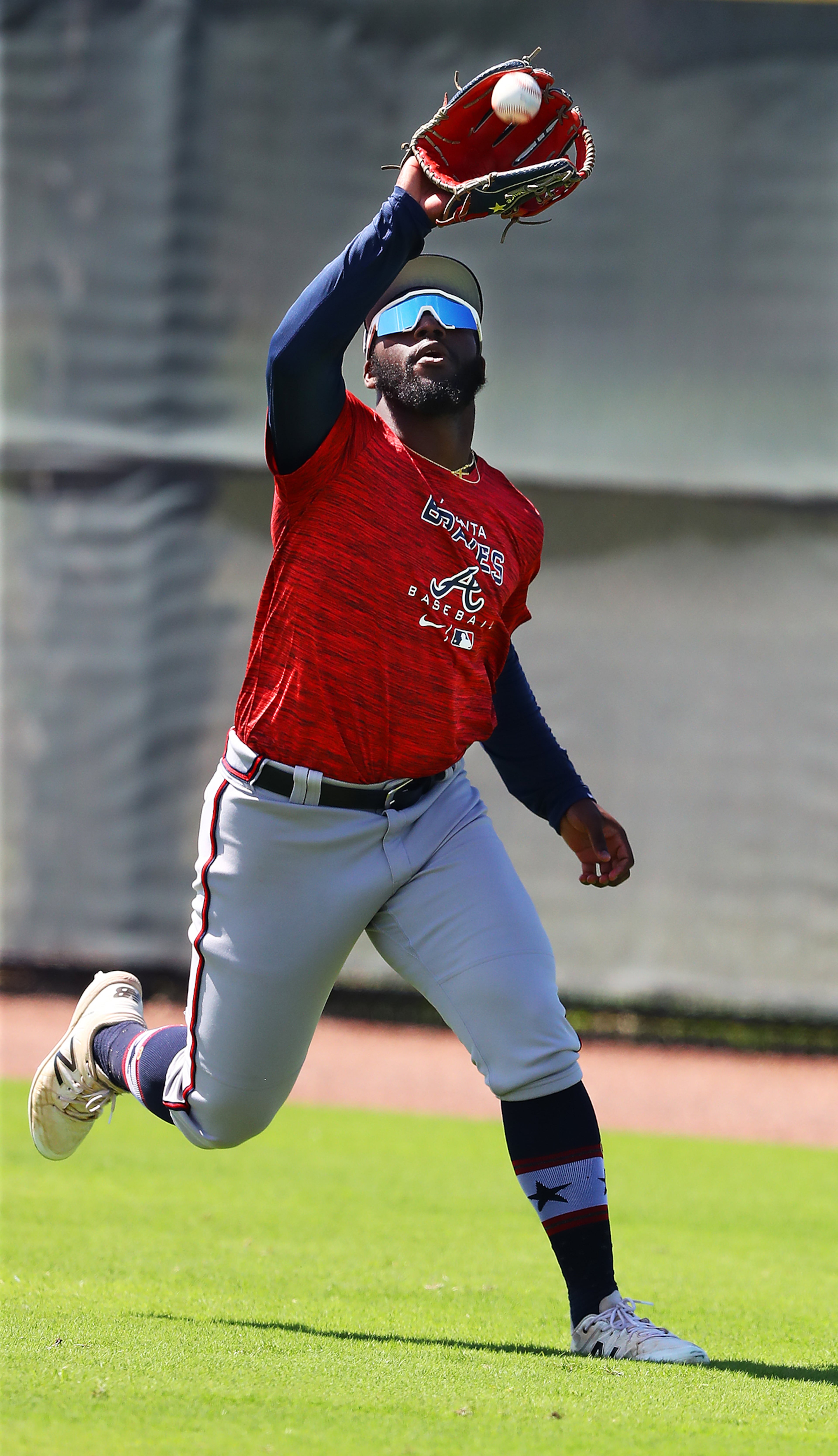 030622 North Port: Atlanta Braves outfielder Michael Harris II runs down a fly ball on the first day of Braves minor league spring training camp on Sunday, March 6, 2022, in North Port. “Curtis Compton / Curtis.Compton@ajc.com”`