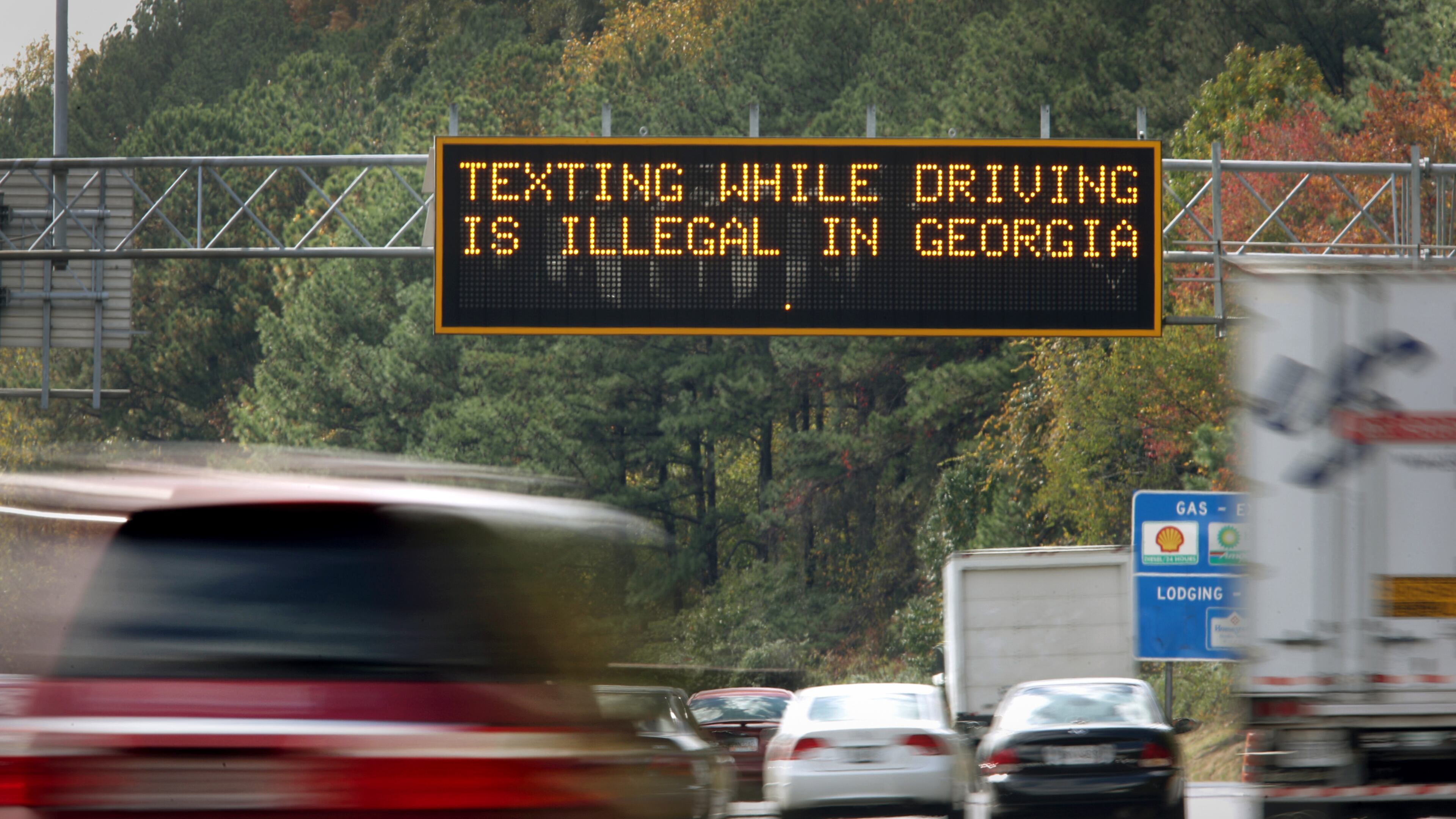 October 25, 2012 - Atlanta, Ga: A highway warning sign on I-285 westbound alert motorists that, "Texting while driving is illegal in Georgia, " before exit 22 near I-75 on the north side of Atlanta Thursday afternoon in Atlanta, Ga., October 25, 2012. Georgia's law outlawing texting while driving has proven diffficult to enforce. Police are writing fewer tickets than expected, raking in far less revenue than supporters of the measure had hoped. JASON GETZ / JGETZ@AJC.COM