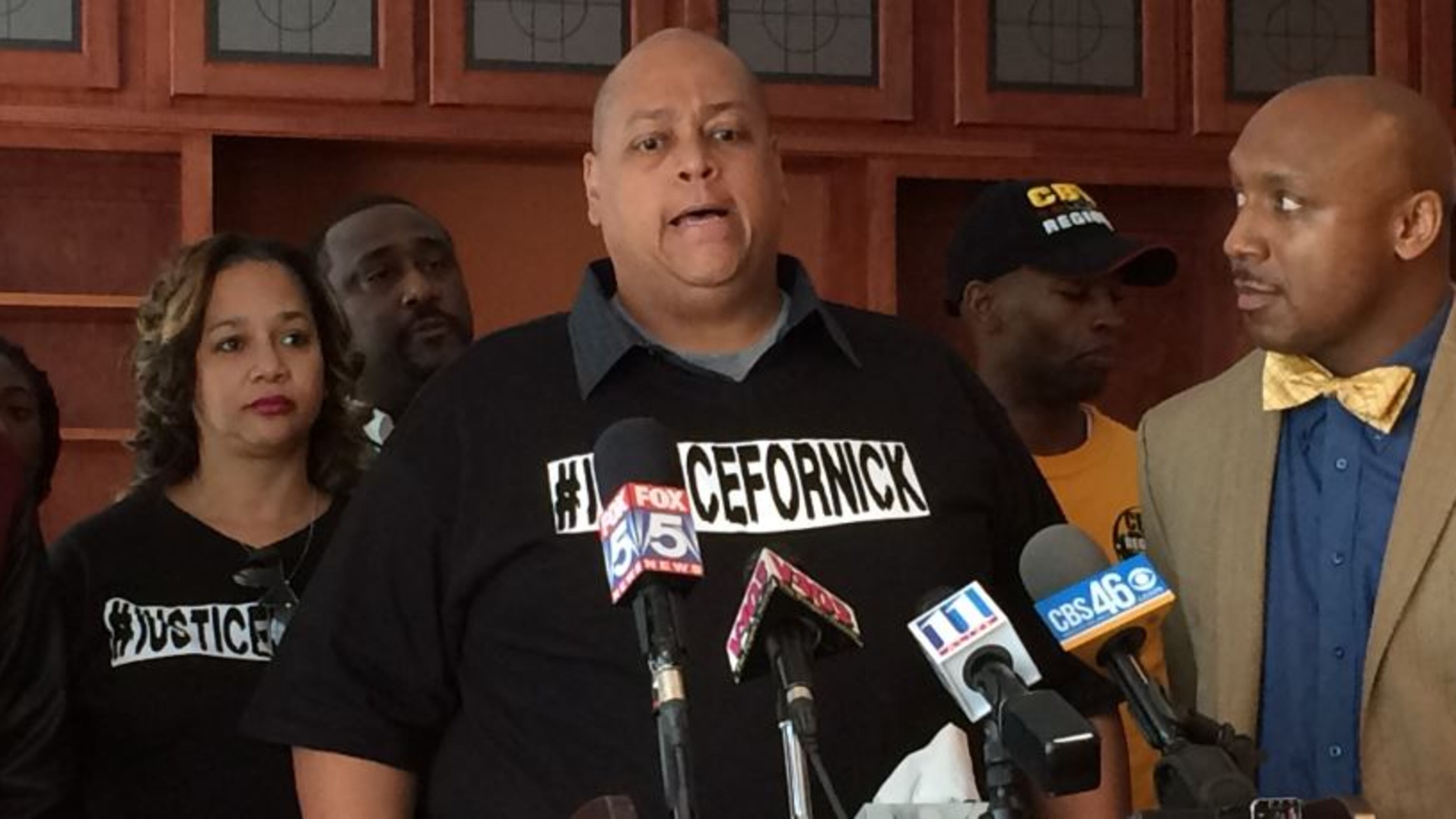 Felicia and Huey Thomas, parents of Nicholas Thomas, with attorney Mawuli Mel Davis at Thursday news conference. (TYLER ESTEP / TYLER.ESTEP@COXINC.COM)