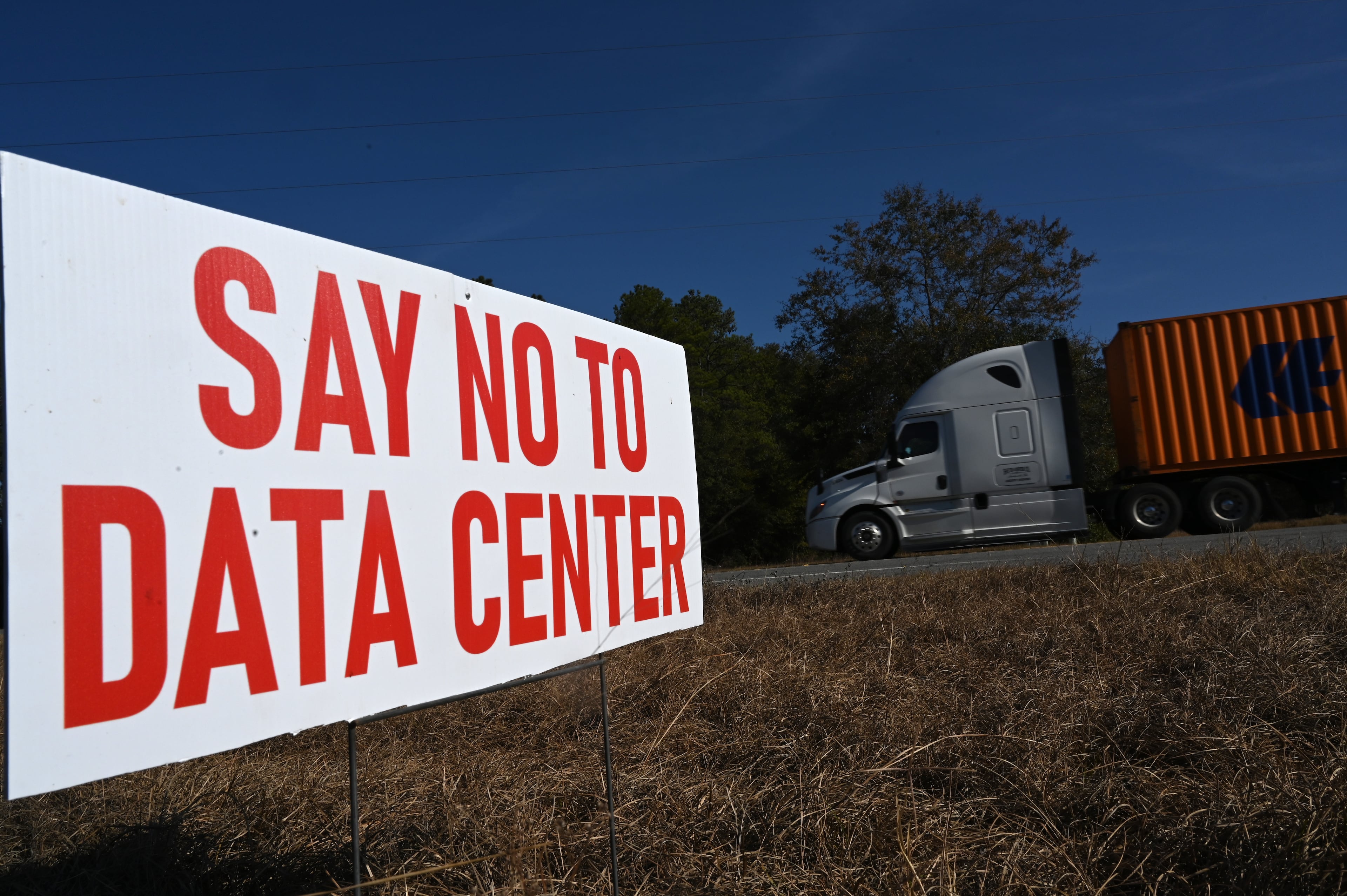 A “Say No to Data Center” sign is displayed near the proposed data center site in Twiggs County, Wednesday, Nov. 19, 2025, in Dry Branch. A proposal to rezone nearly 300 acres of timberland for a data center in Twiggs County is drawing widespread criticism from residents. (Hyosub Shin/AJC)