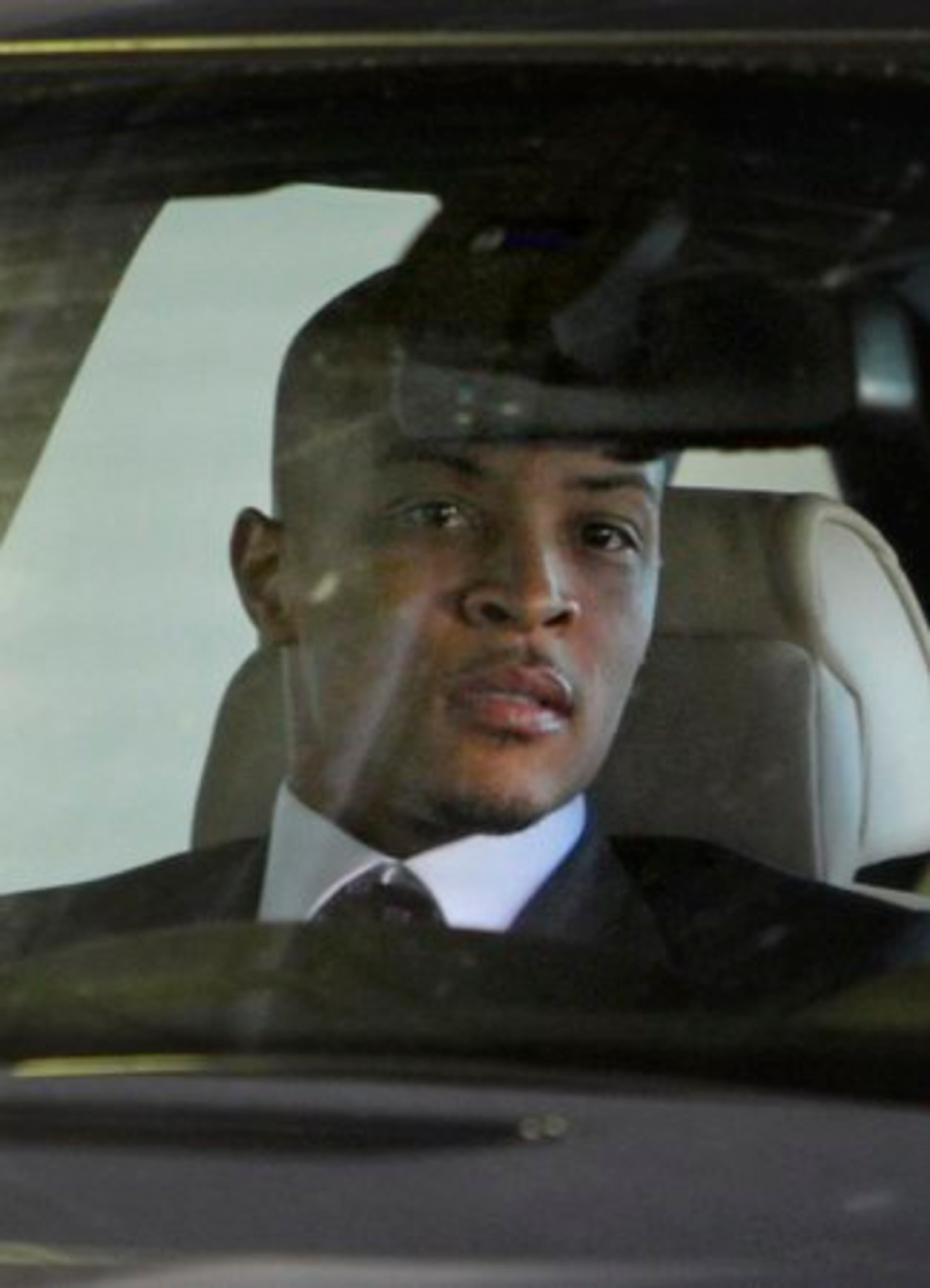 Rapper T.I., whose real name is Clifford Harris Jr., leaves Federal Court after being sentenced to 11 months in prison for a probation violation, Friday, Oct. 15, 2010, in Atlanta. The rapper is expected to surrender voluntarily to authorities Nov. 1.