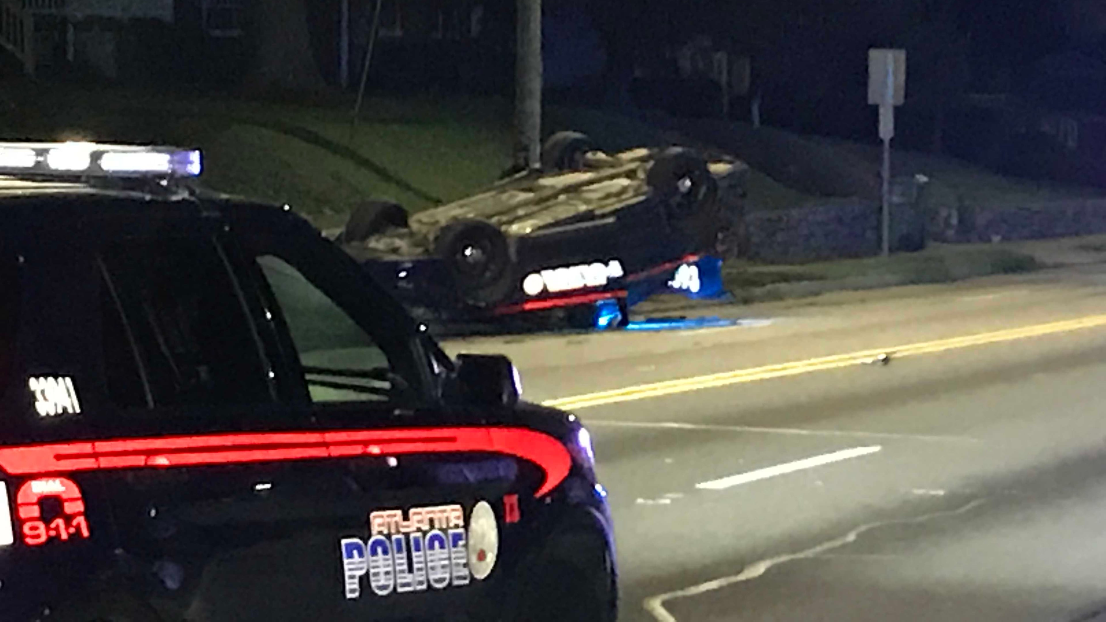 An Atlanta police officer was not seriously hurt when he crashed his patrol car and it flipped over, police said.