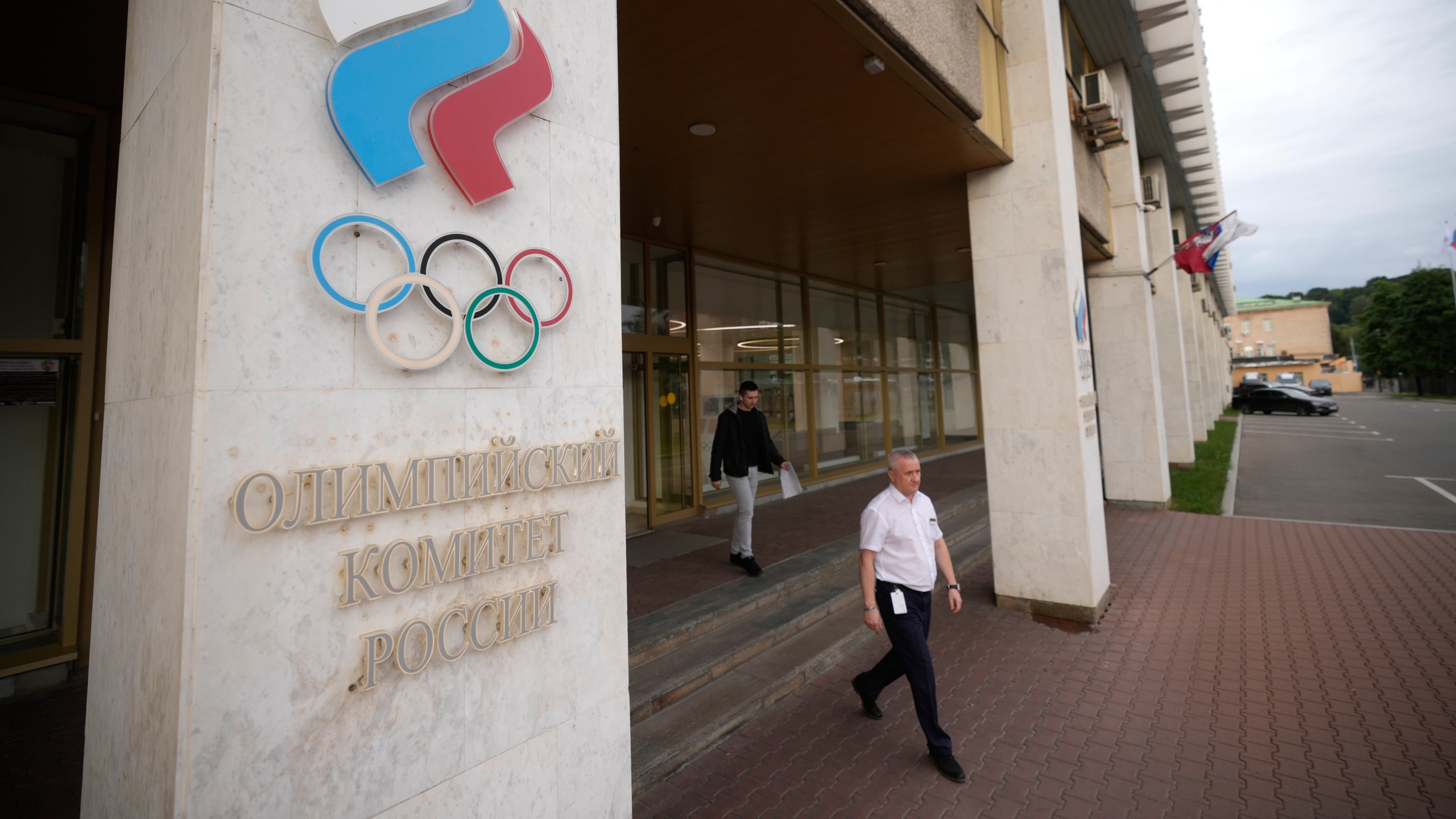 A man walks from the Russian National Olympic Committee building in Moscow, on Tuesday, July 7, 2026. (AP Photo/Pavel Bednyakov)