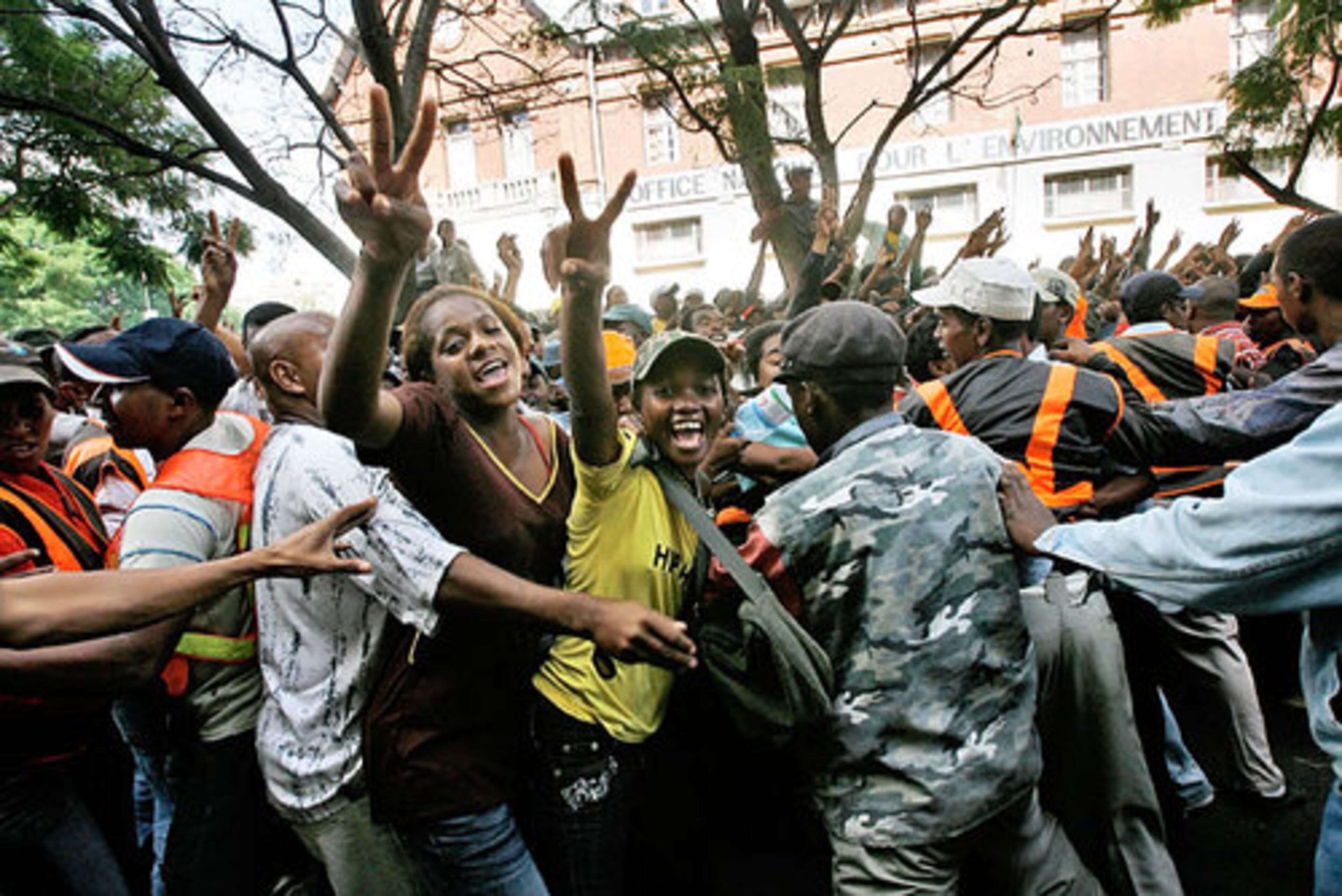 Madagascar's president announced Tuesday that he was dissolving the government and handing power to the military after weeks of struggle with the leader of the opposition on the impoverished Indian Ocean island. Here, supporters cheer opposition leader Andry Rajoelina as he parades through the narrow streets of Antananarivo, Madagascar.