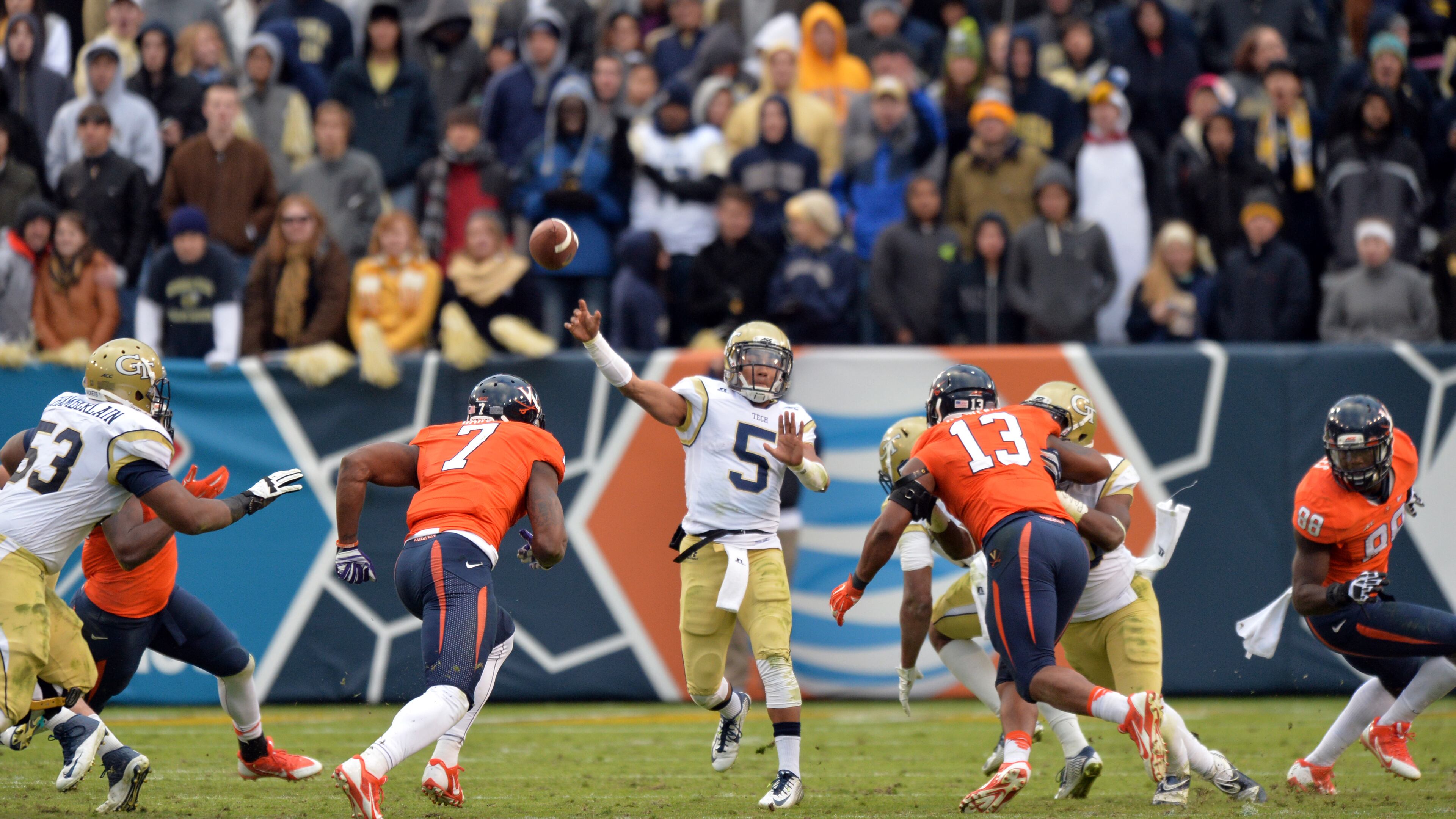 Georgia Tech Yellow Jackets quarterback Justin Thomas (5) gets off a pass against the Virginia Cavaliers in the second half at Bobby Dodd Stadium on Saturday, November 1, 2014. Georgia Tech Yellow Jackets won 35-10 over the Virginia Cavaliers. HYOSUB SHIN / HSHIN@AJC.COM