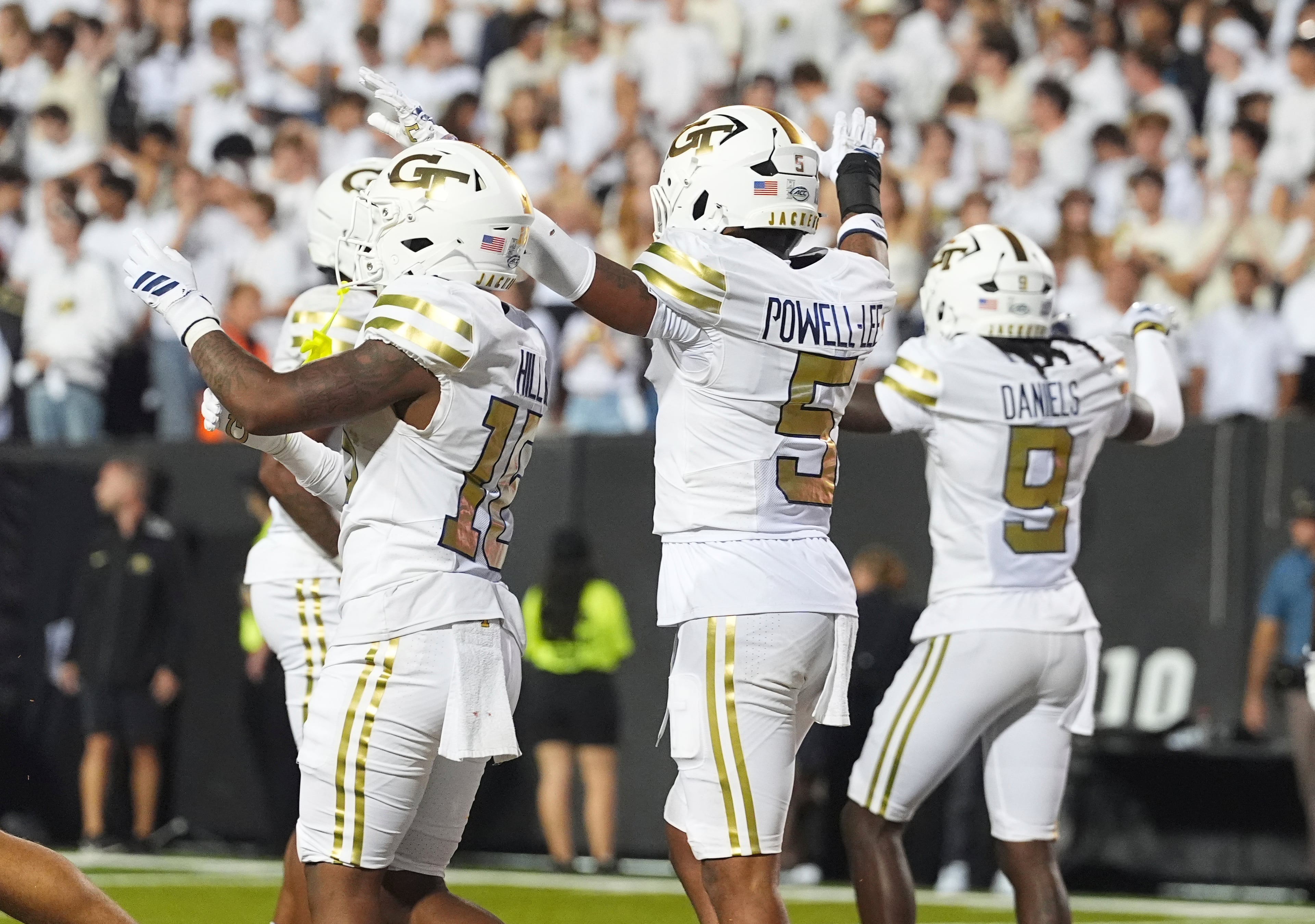 Georgia Tech linebacker Tah'j Butler (from left) and defensive backs Clayton Powell-Lee and Omar Daniels celebrate after defeating Colorado on Friday, Aug. 29, 2025, in Boulder, Colo. (David Zalubowski/AP)