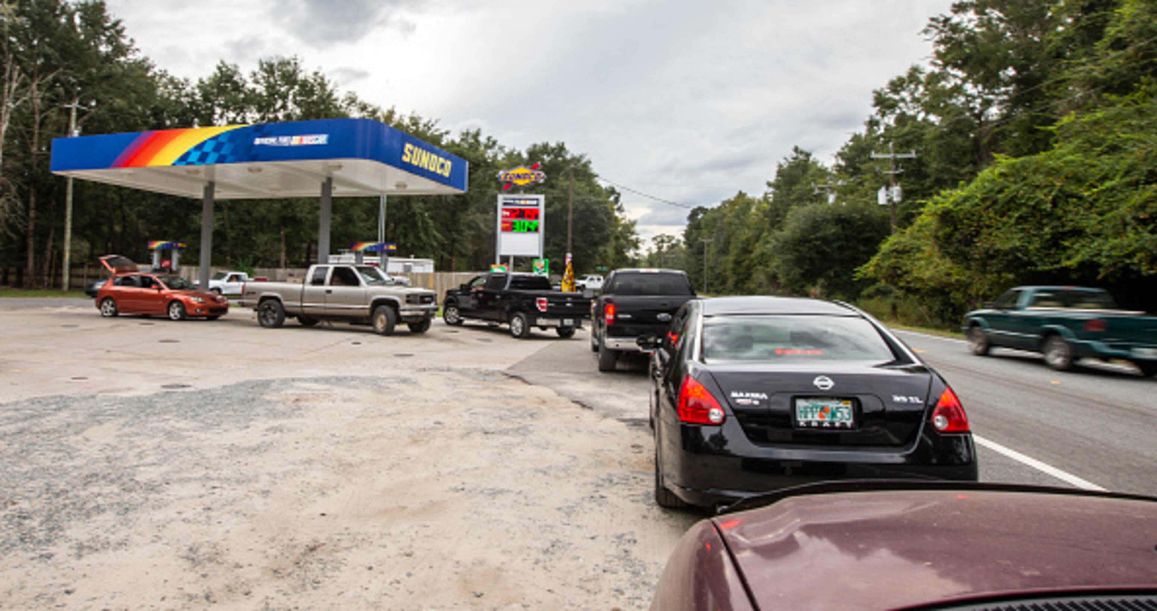 TALLAHASSEE, FL - OCTOBER 08: People line up for gasoline as Hurricane Michael bears down on the northern Gulf coast of Florida on October 8, 2018 outside Tallahassee, Florida. Michael was forecast to become a Category 3 storm with sustained winds of 120 mph when it makes landfall in the Florida panhandle later this week. (Photo by Mark Wallheiser/Getty Images)