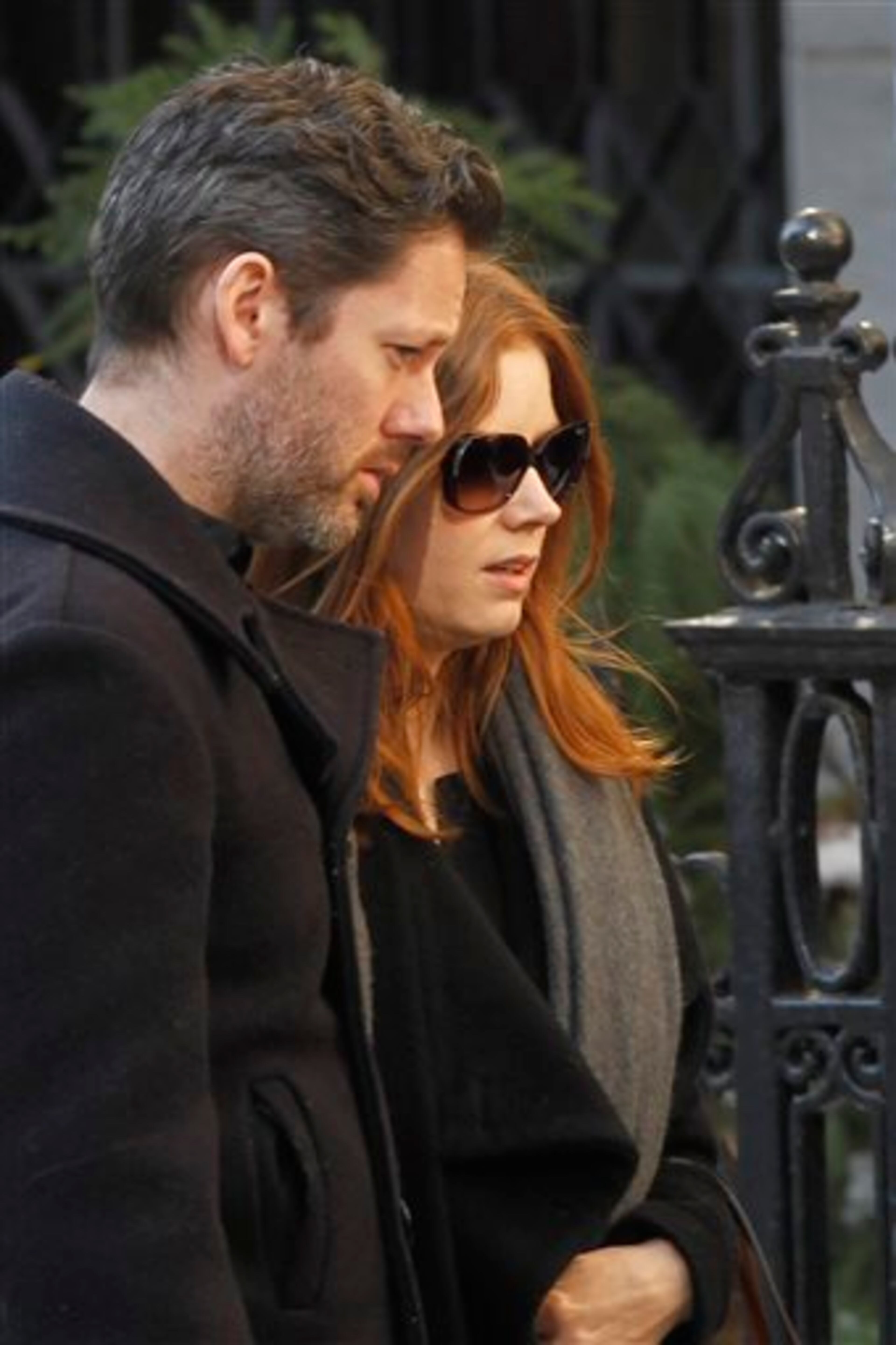 Actress Amy Adams and her fiance Darren Le Gallo arrive at the Church of St. Ignatius Loyola for the private funeral of actor Philip Seymour Hoffman Friday, Feb. 7, 2014, in New York. Hoffman, 46, was found dead Sunday of an apparent heroin overdose. (AP Photo/Jason DeCrow)