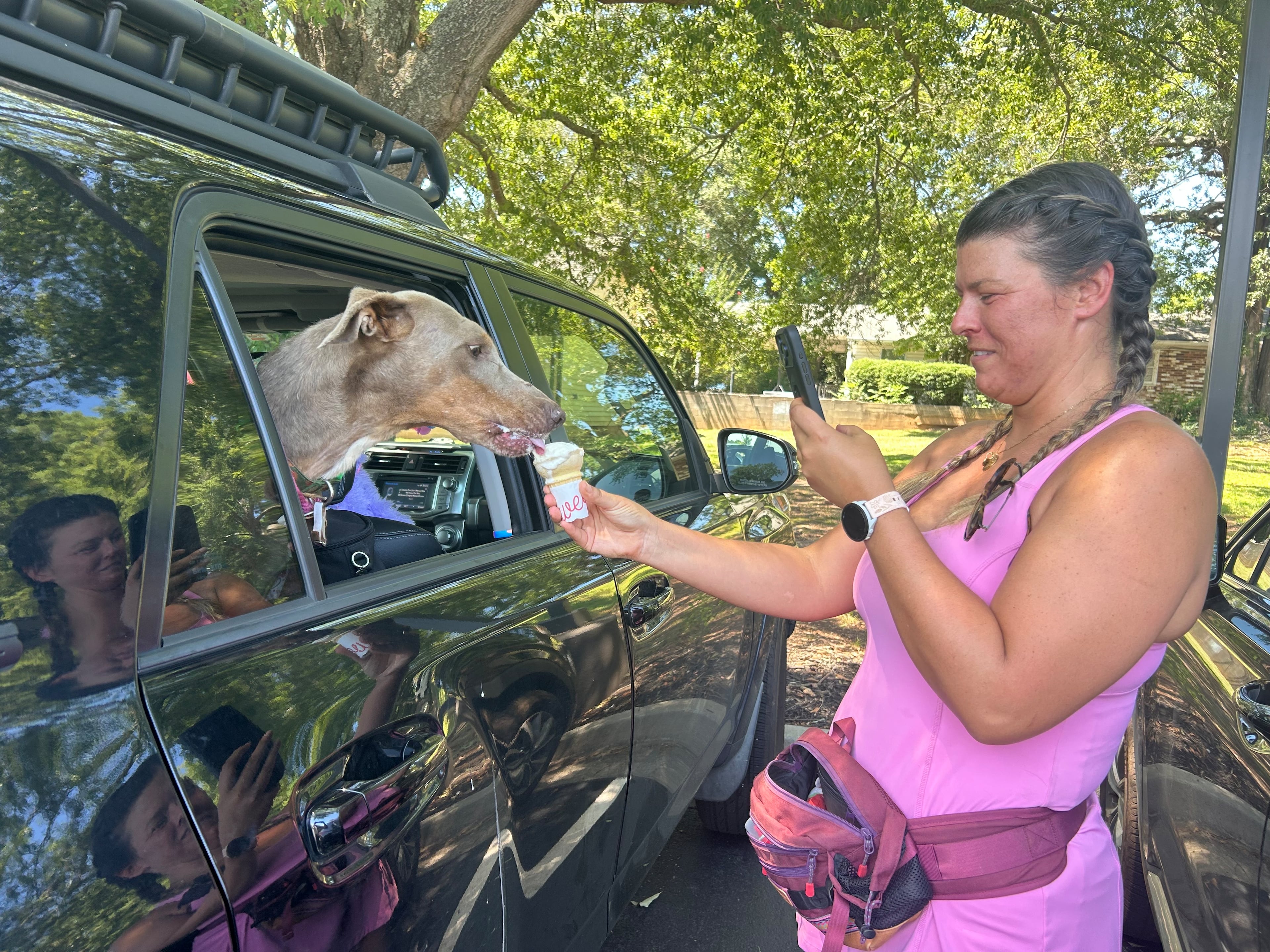 Katie Ceraso has been posting a shelter dog a day in an effort to achieve more visibility for the pups. On a recent weekday, she took Biscuit out for a Chick-fil-A ice cream cone and filmed a video. (Olivia Wakim/AJC)