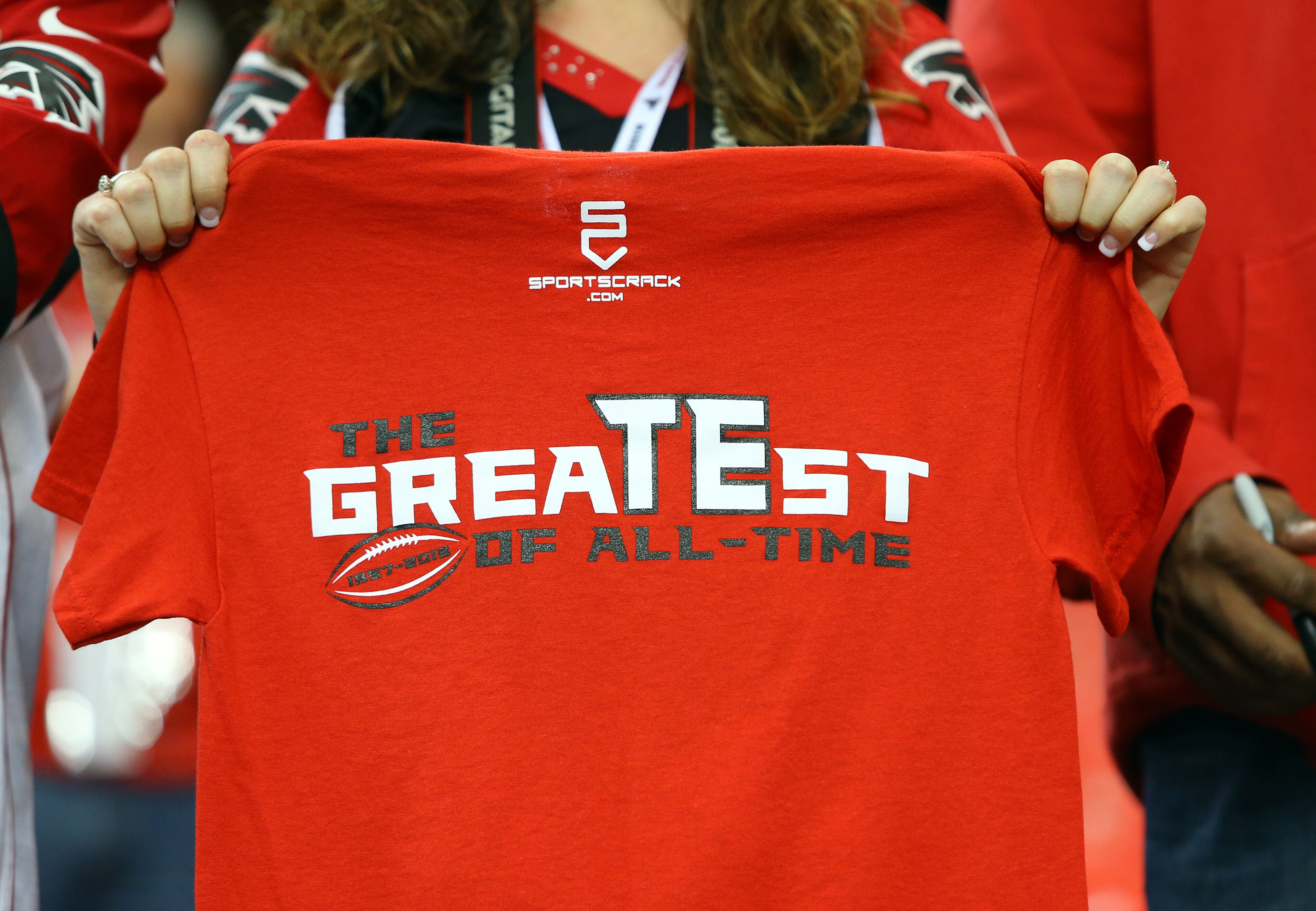 Sidney Sears, Gainesville, holds out the back of her shirt in support of Falcons tight end Tony Gonzalez while he takes the field for the final game of his 17-year NFL career on Sunday, Dec. 29, 2013, in Atlanta.