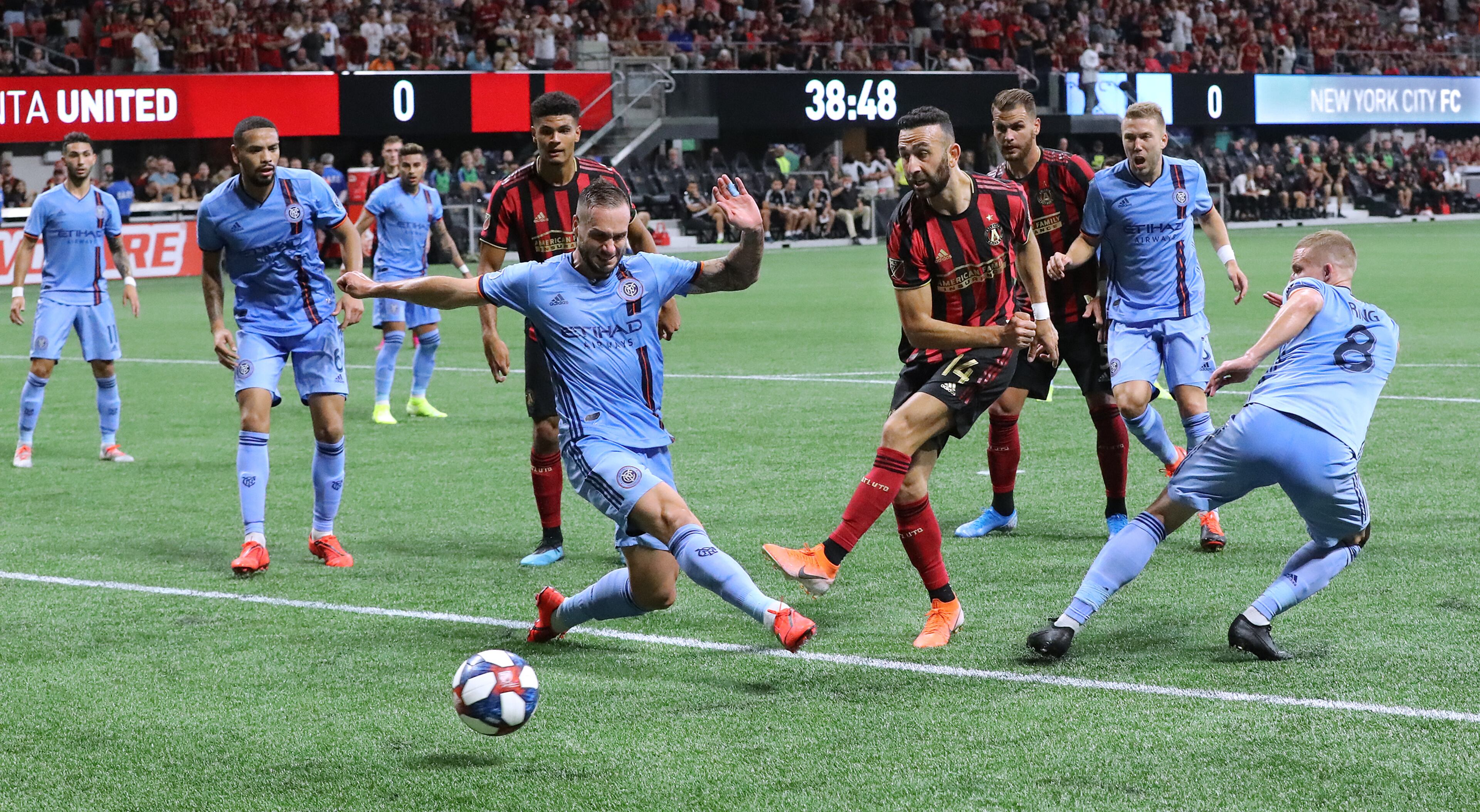 August 11, 2019 Atlanta: Atlanta United midfielder Justin Meram gets off a shot between New York City FC defenders in front of their goal in their soccer match on Sunday, August 11, 2019, in Atlanta. Curtis Compton/ccompton@ajc.com