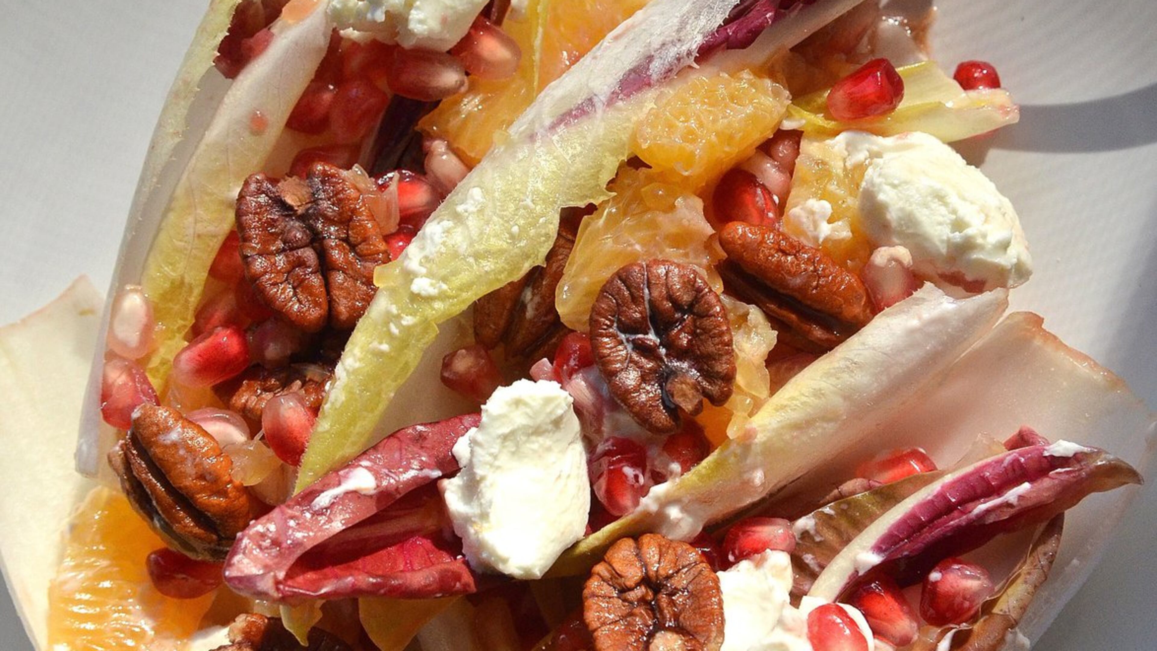 Gerry Klaskala, executive chef and owner of Aria in Buckhead, builds this Pomegranate, Mandarin and Endive Salad with Pecans and Fresh Goat Cheese from seasonal ingredients. (PHOTO BY CHRIS HUNT/SPECIAL. STYLING BY WENDELL BROCK)