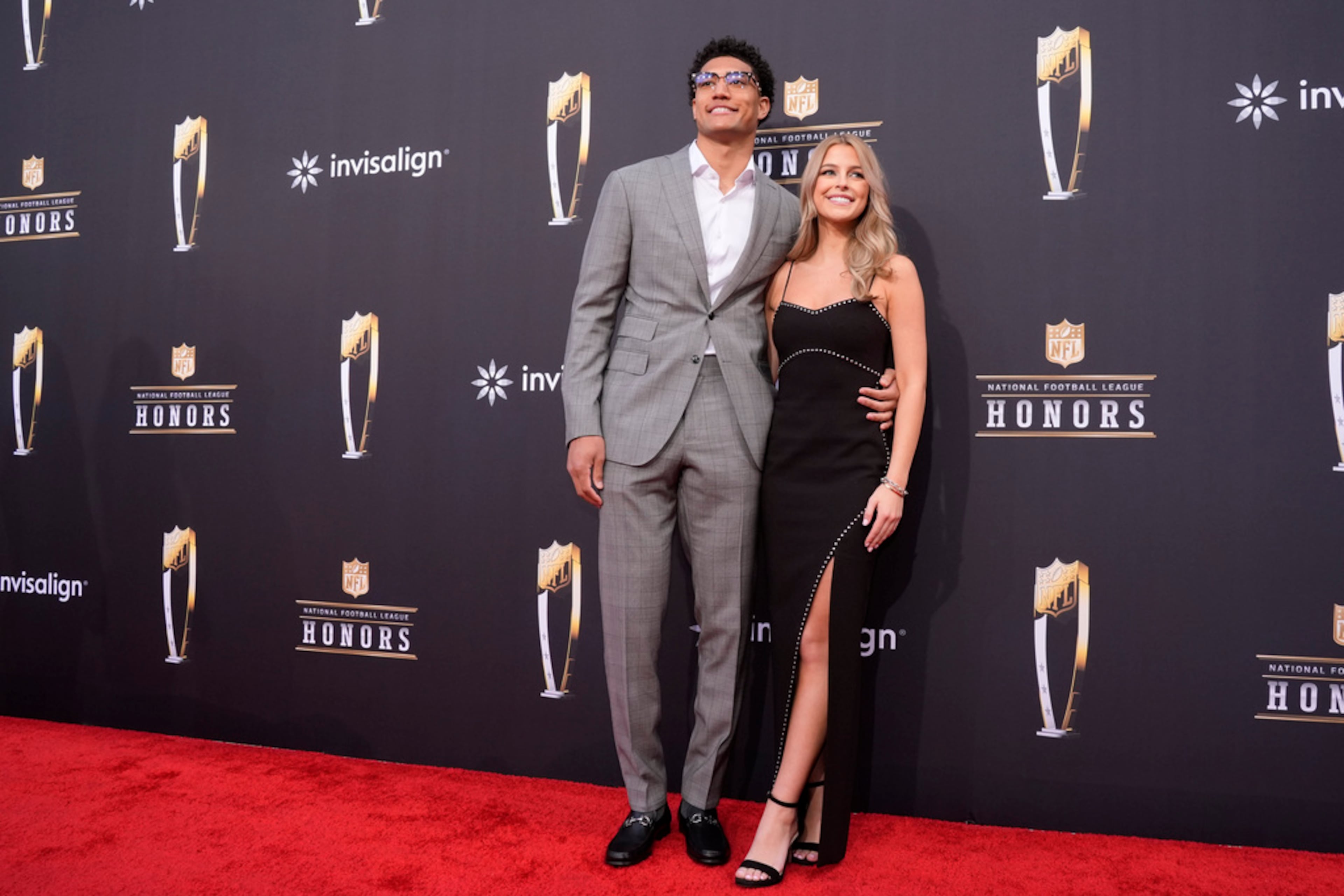 Kyle Hamilton of the the Baltimore Ravens, left, and girlfriend Reese Damm pose on the red carpet at the NFL Honors award show ahead of the Super Bowl 58 football game Thursday, Feb. 8, 2024, in Las Vegas. The San Francisco 49ers face the Kansas City Chiefs in Super Bowl 58 on Sunday. (AP Photo/Charlie Riedel)