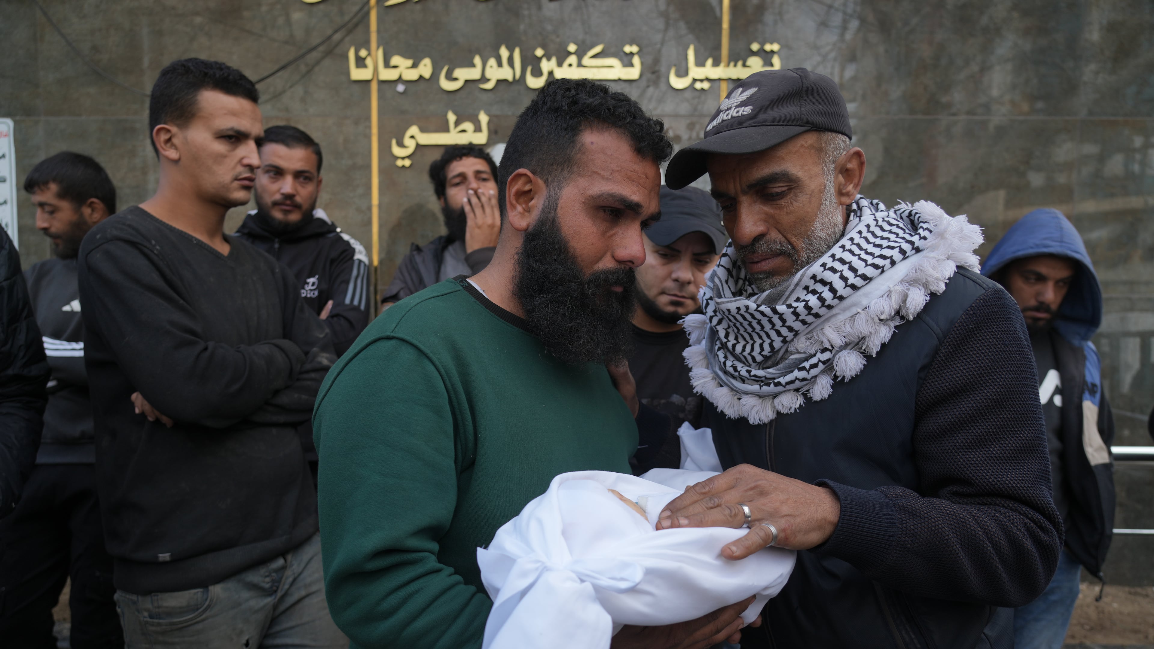 Palestinian Raed al-Khabba carries his 3-month-old daughter Mira al-Khabbaz, who was killed in an Israeli military strike, at Shifa Hospital in Gaza City, Wednesday, Feb. 4, 2026. (AP Photo/Jehad Alshrafi)