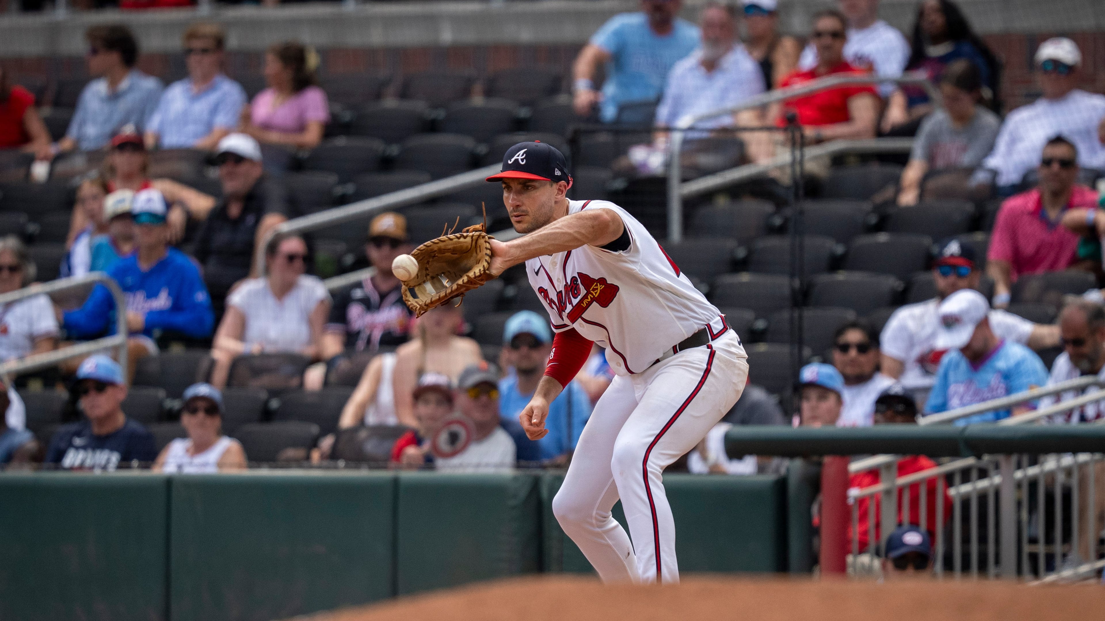 Atlanta Braves first baseman Matt Olson catches a groundout during the seventh inning of a baseball game against the Arizona Diamondbacks, Sunday, Aug. 16, 2026, in Atlanta. (AP Photo/Erik Rank)