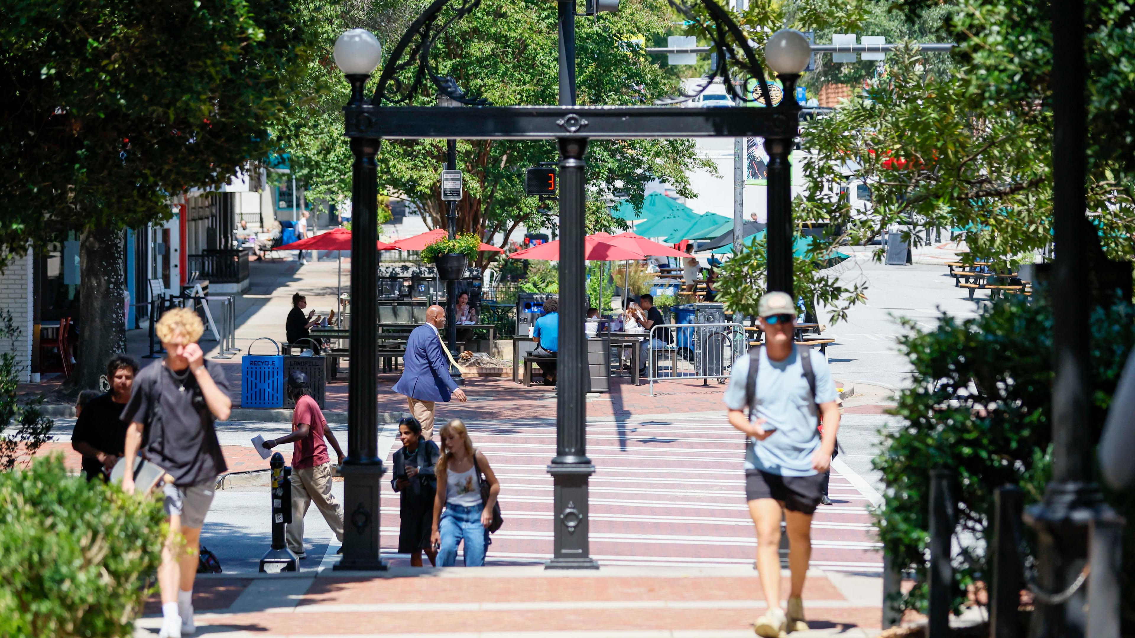 Students walk through campus as they cross the iconic Arch at the University of Georgia in Athens on Monday, Sept. 8, 2025. (Miguel Martinez/ AJC)
